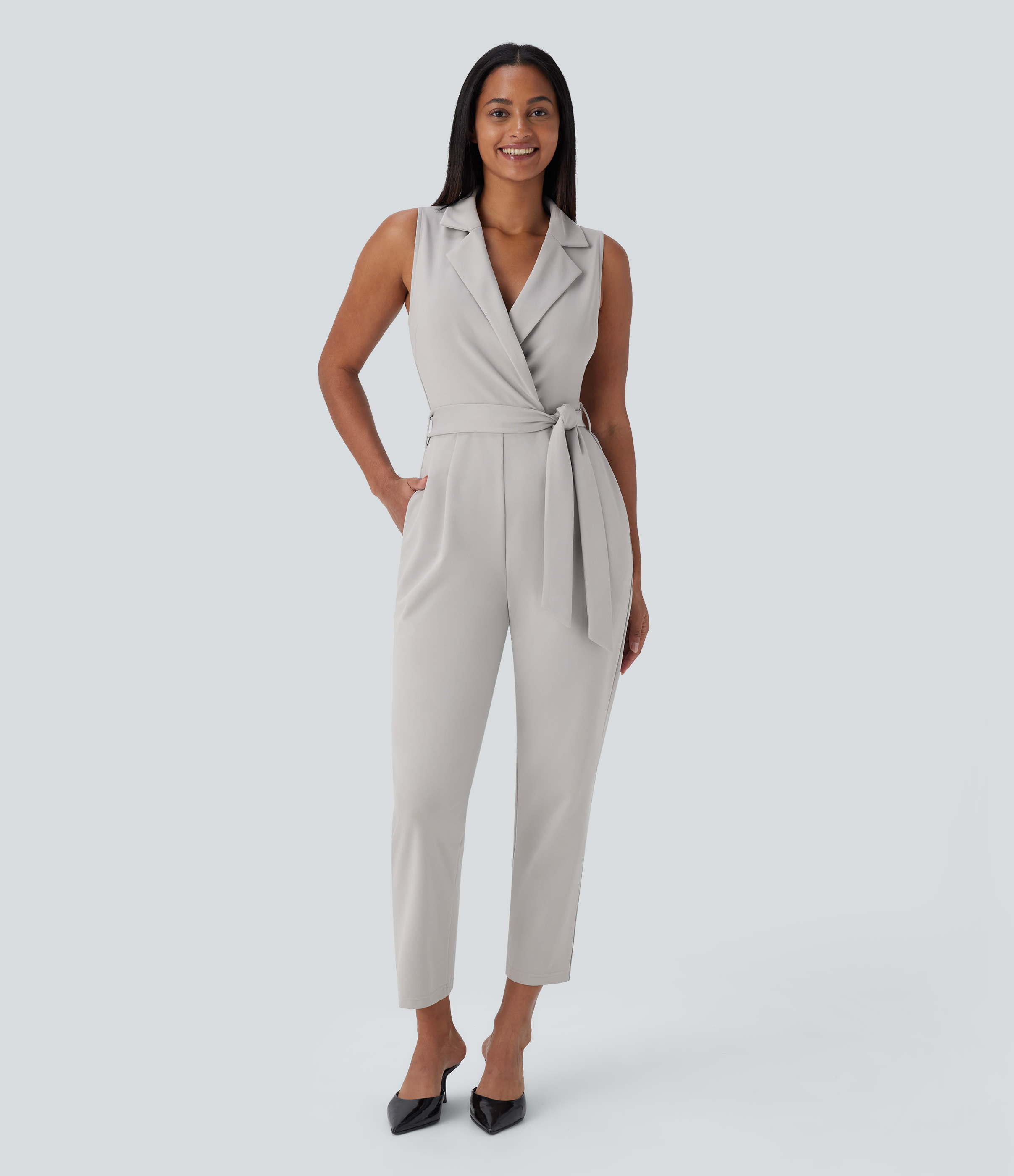 Combinaison de travail sans manches à poches et ceinture fuselée