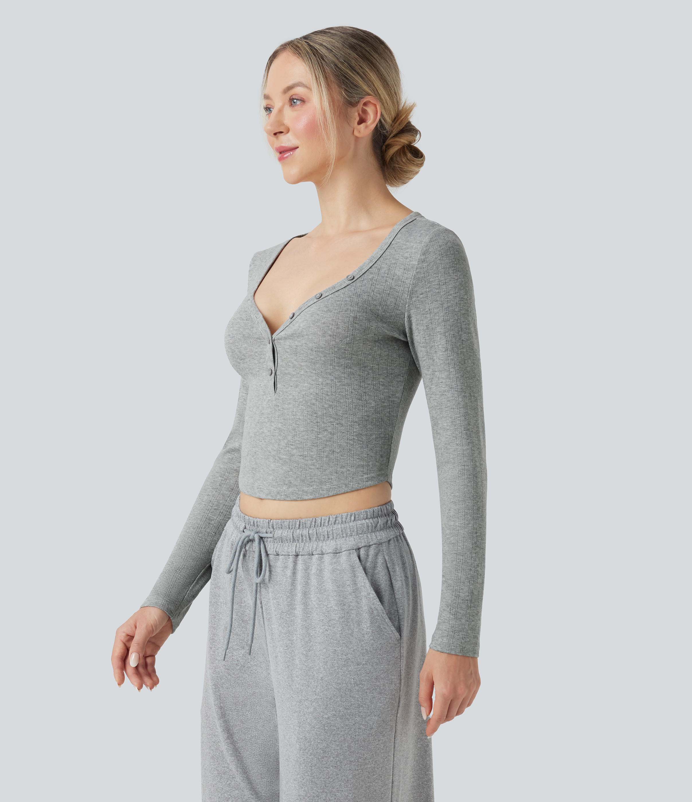 Relaxed fit cropped ribbed knit henley collar long sleeves