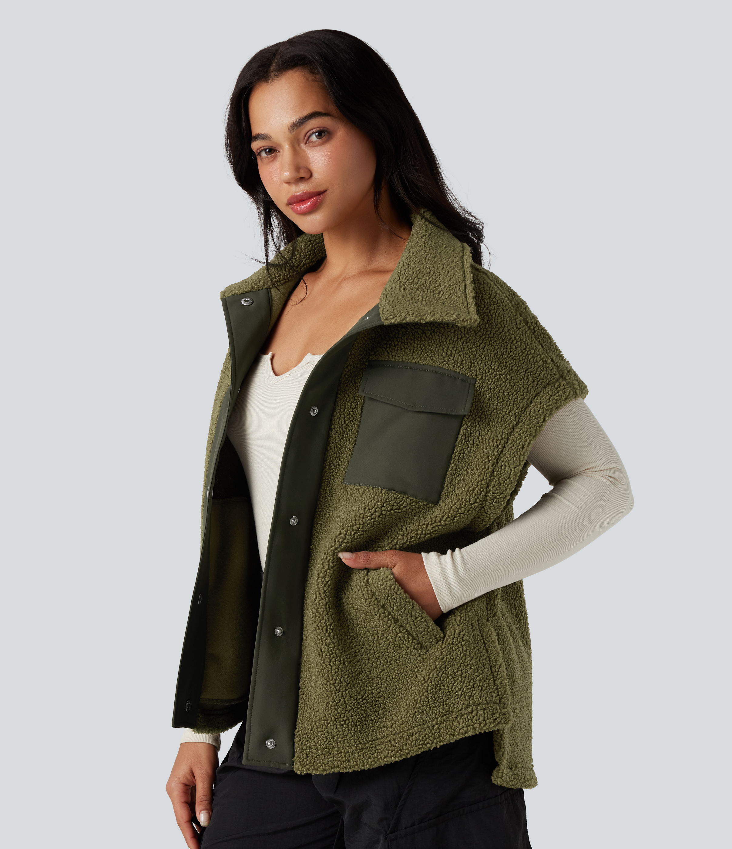 Sherpa hiking vest with stand-up collar, multiple pockets, flutter sleeves and color blocking