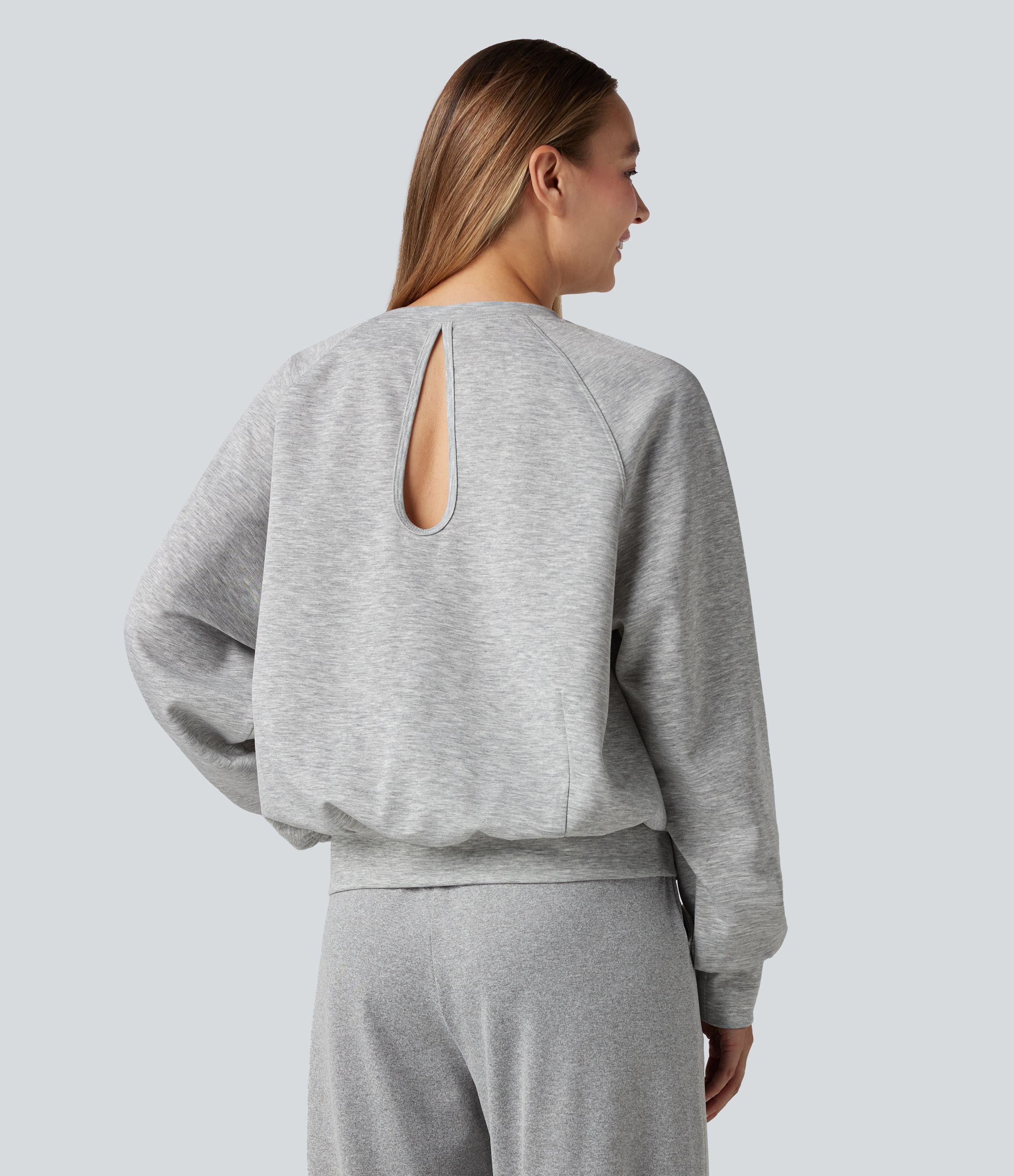 Sweat-shirt col rond manches longues à découpes avec poches