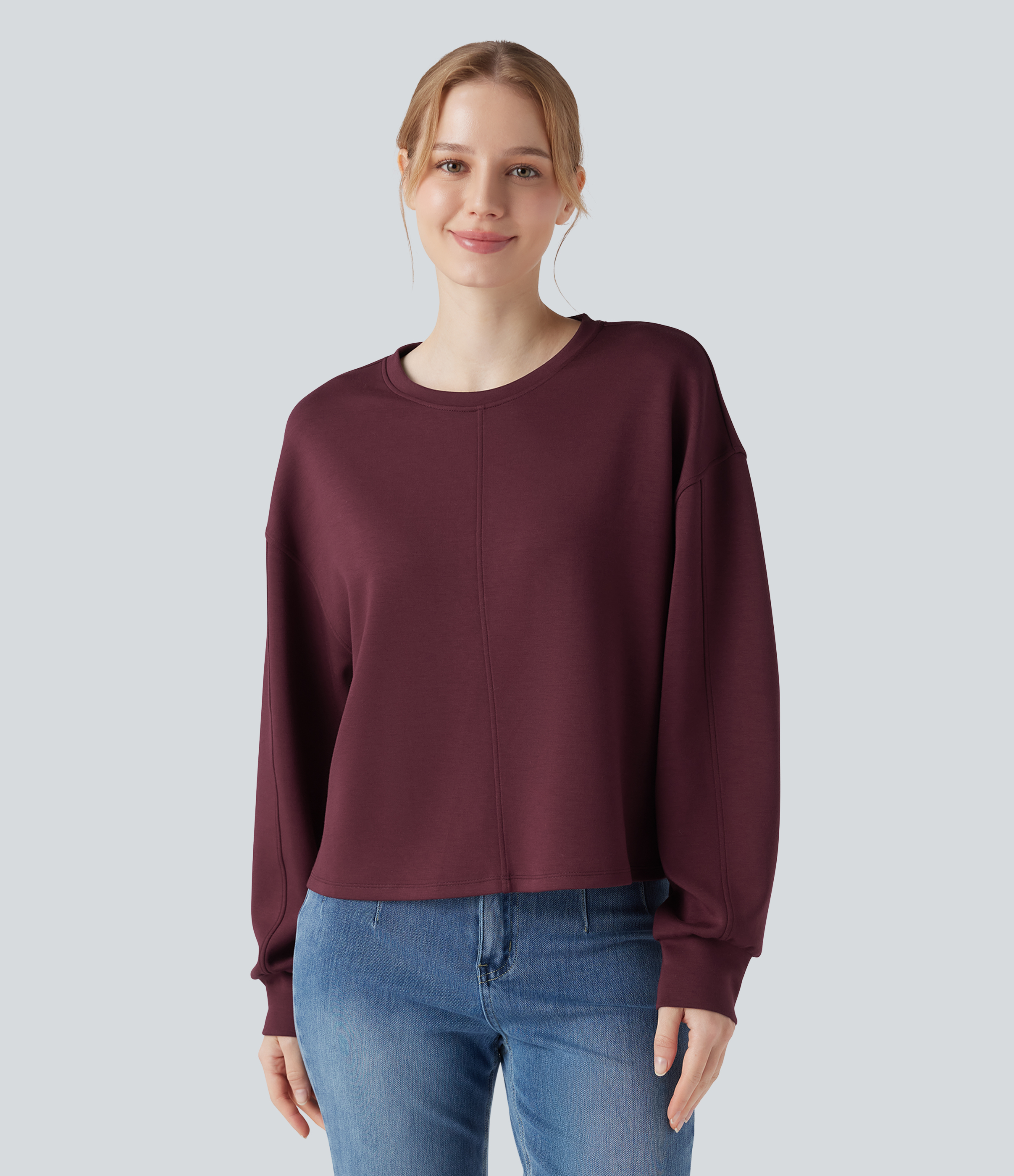 Sudadera casual de cuello redondo y mangas largas con bajo asimétrico (más larga por detrás)