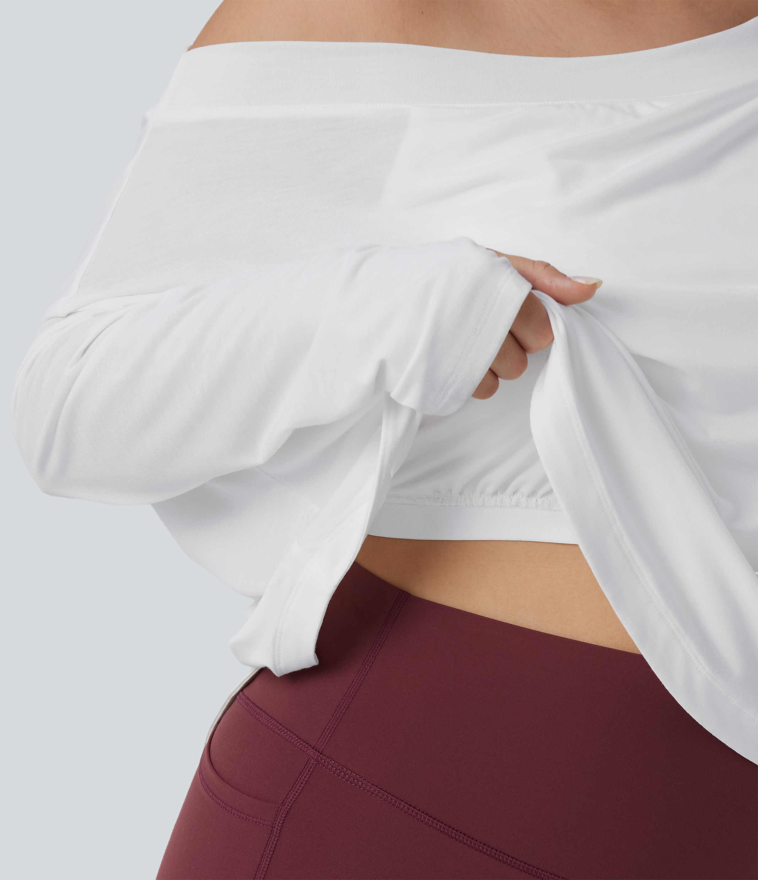 Yoga-Sport-Top mit integriertem BH, langen Ärmeln, Daumenlöchern, One-Shoulder-Design und abgerundetem Saum - schnelltrocknend