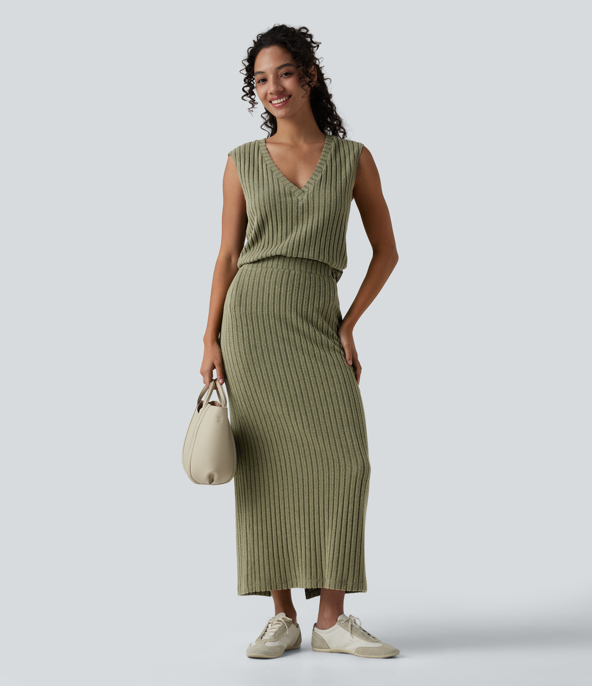 2-piece set featuring a sleeveless, ribbed knit V-neck top and a high-waisted midi skirt