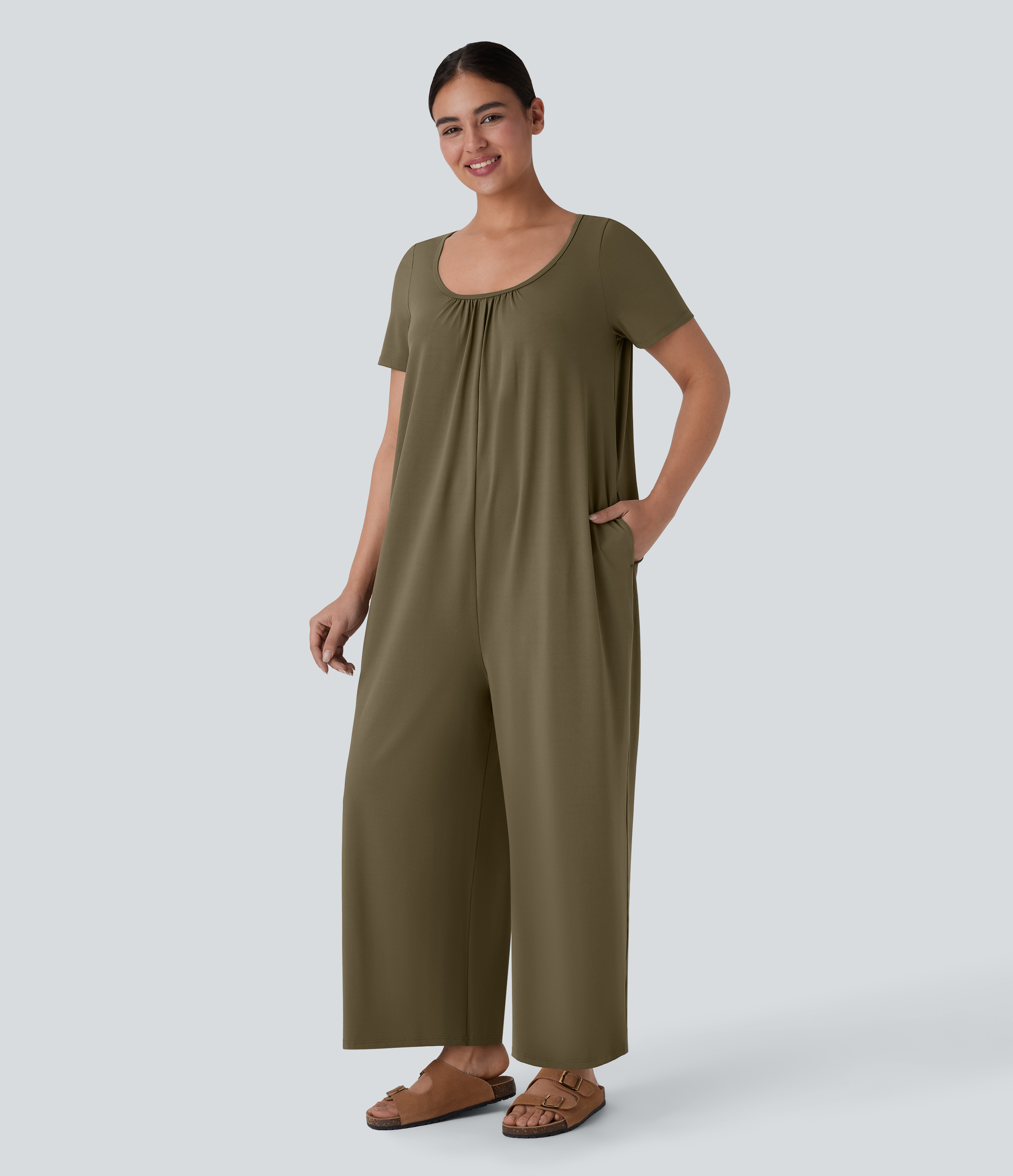 Mono holgado cuello redondo botón posterior bolsillo lateral