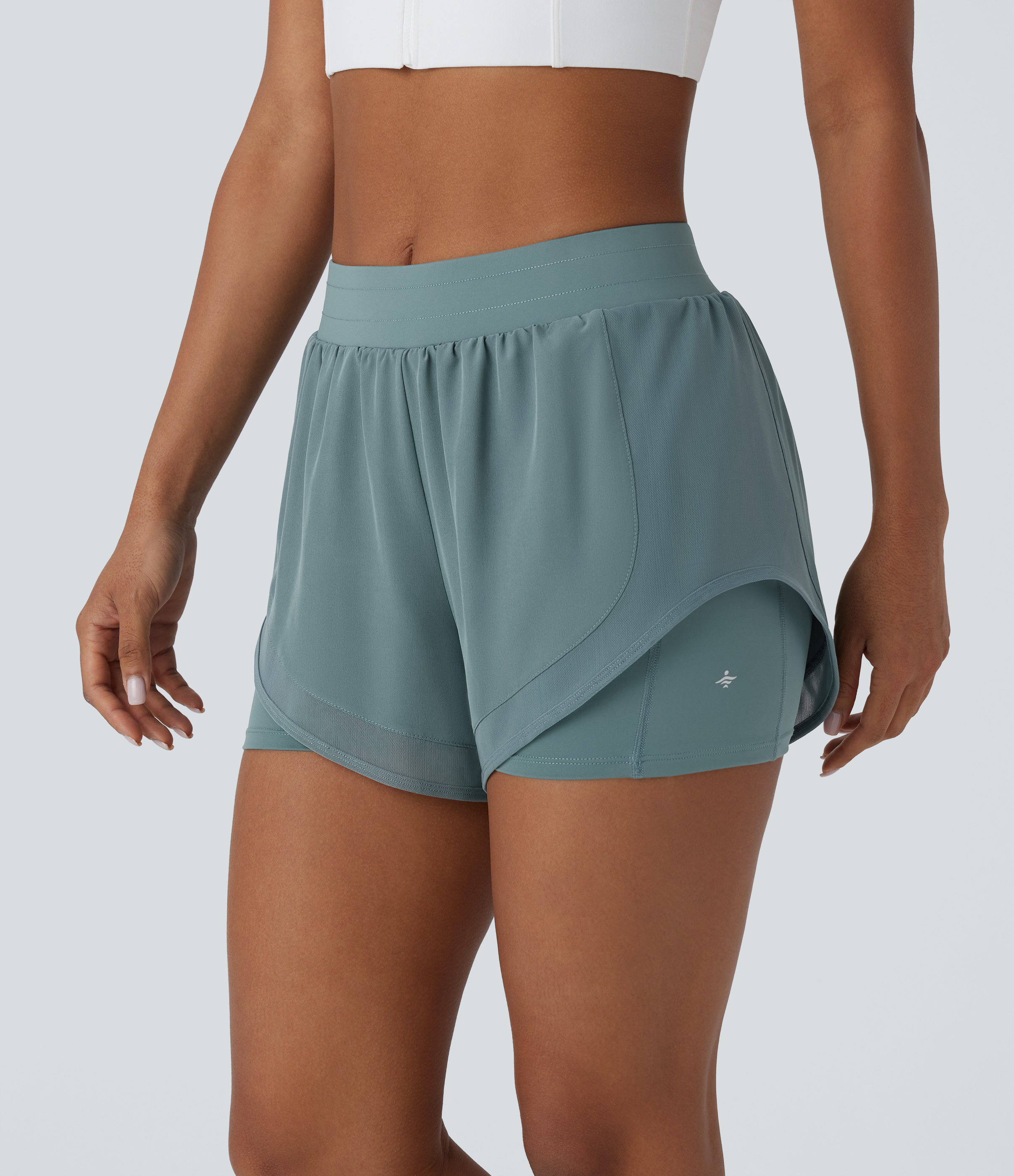 2-in-1 Yoga-Shorts mit mittelhohem Bund, Seitentaschen, kontrastierendem Netzstoff und abgerundetem Saum - 7,6 cm