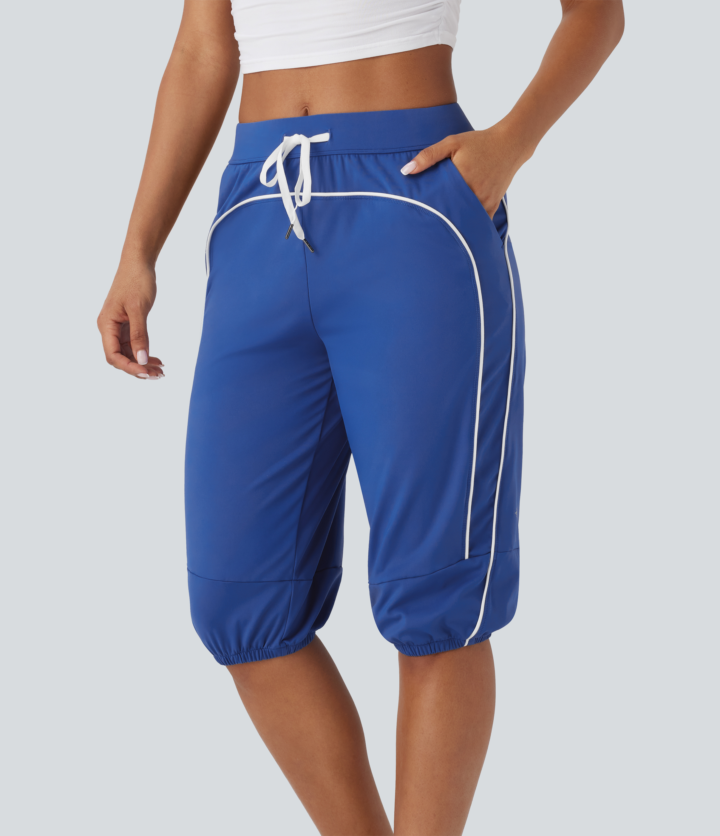 Pantalones deportivos capri Softlyzero™ Airy UPF50+ de tiro medio con cordón, bolsillos laterales y líneas en contraste con tejido fresco al tacto