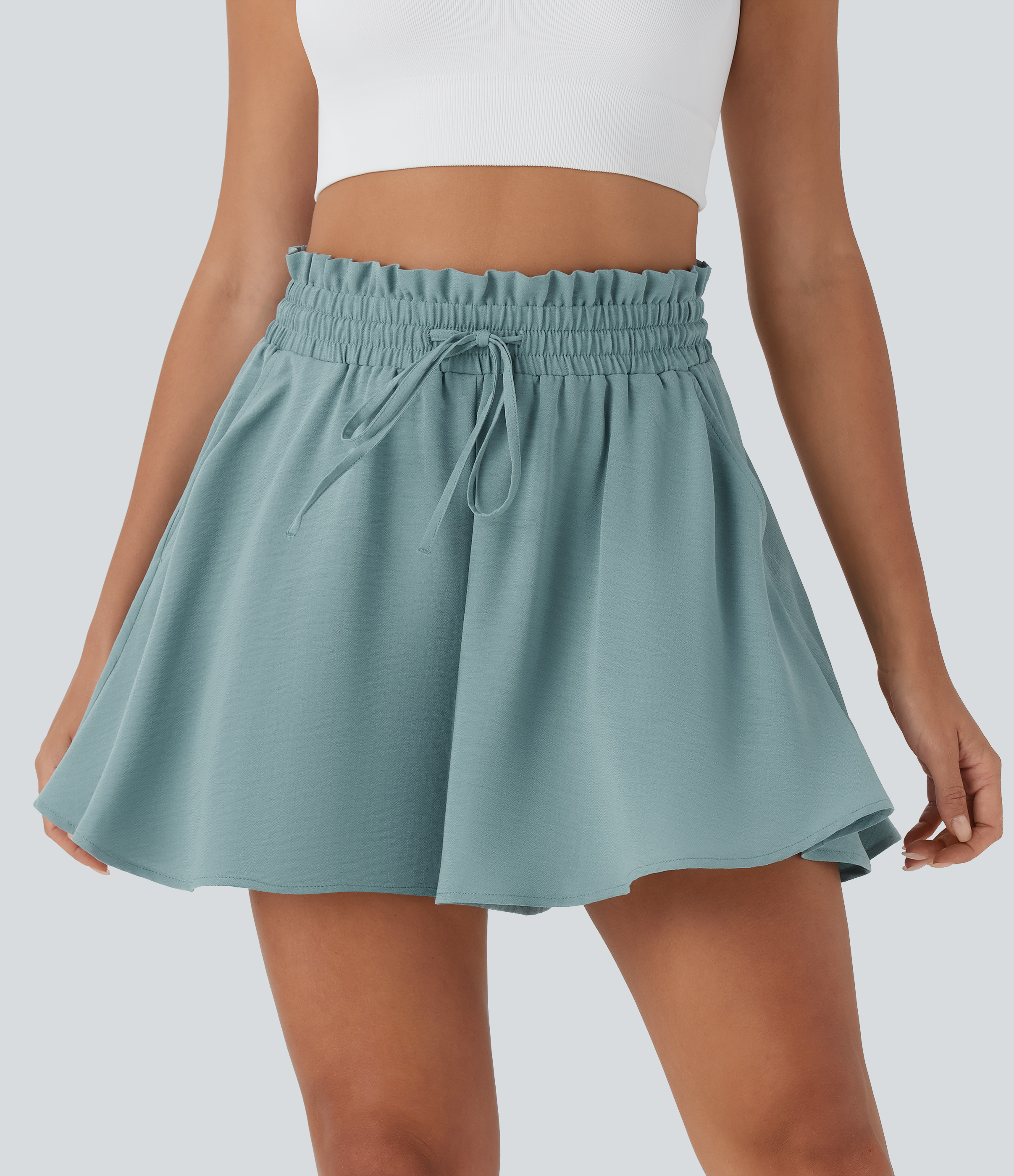 Pantalón corto lino tiro alto bolsillo lateral cordón ajustable pierna ancha