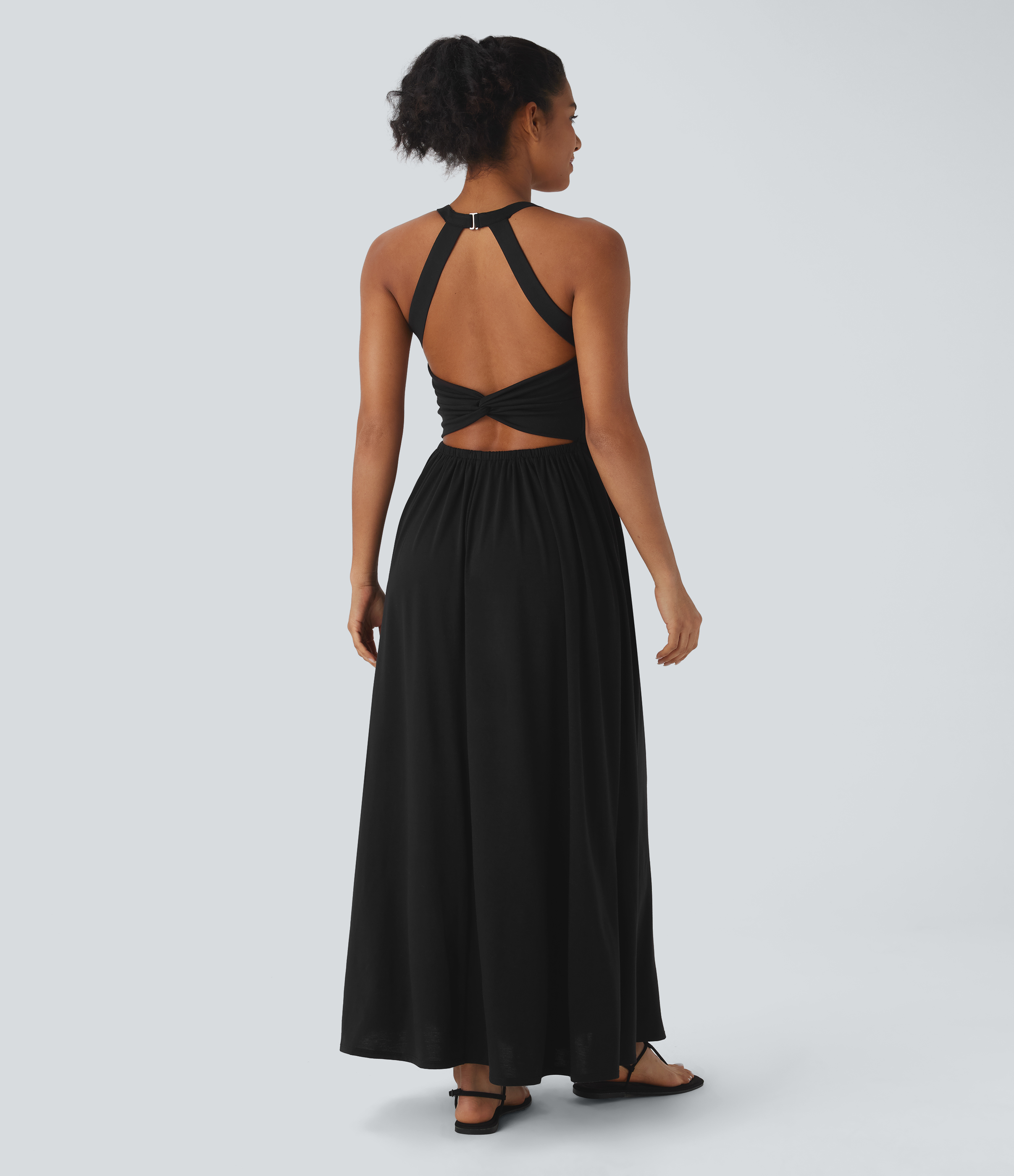 Robe longue fluide fendue avec poches latérales, dos nu et effet torsadé