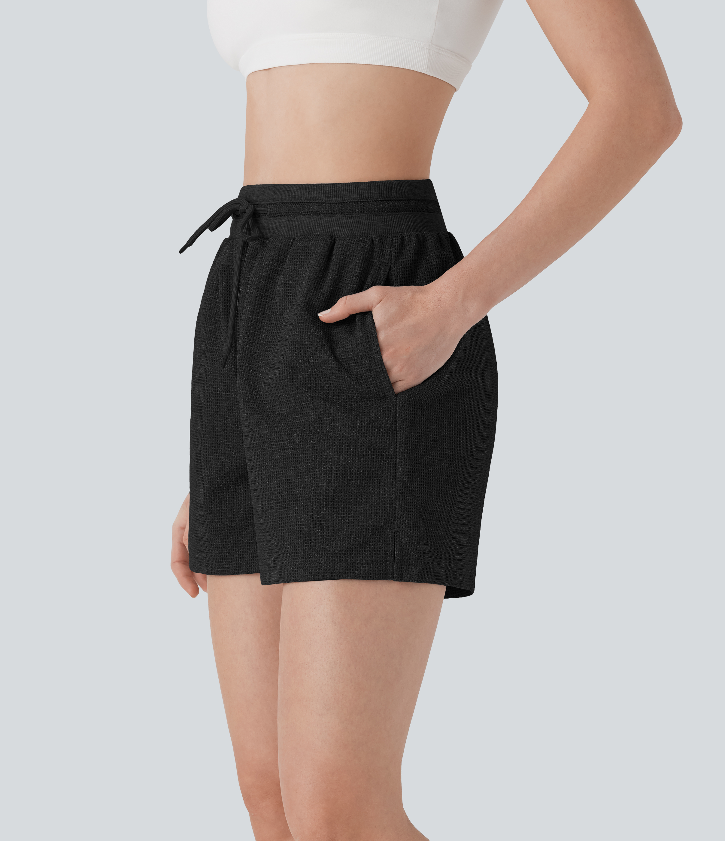 Negro Shorts de yoga de cintura alta con cordón, de tejido gofre y con bolsillos / 1