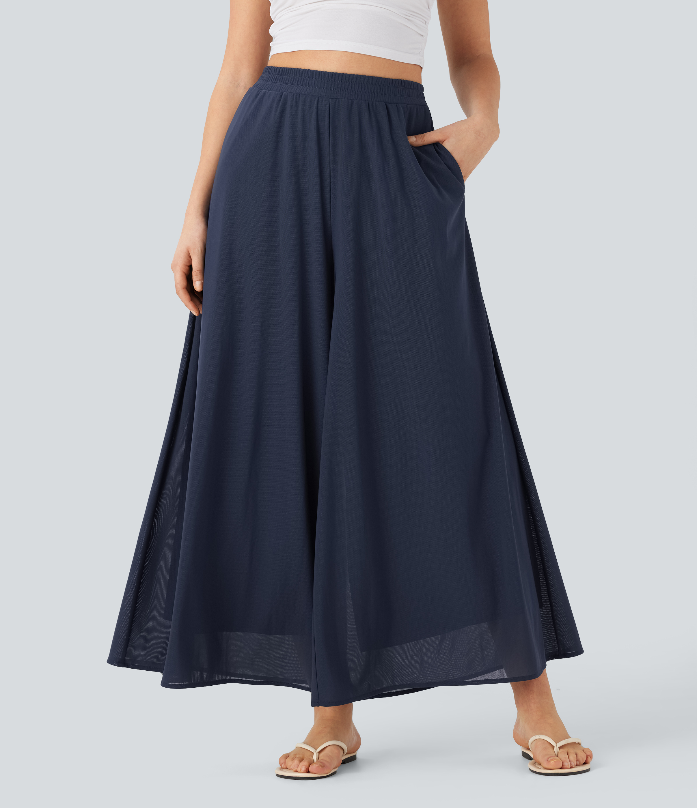 Fließende, locker sitzende Hose mit Mesh-Einsatz, Seitentaschen und hohem Bund