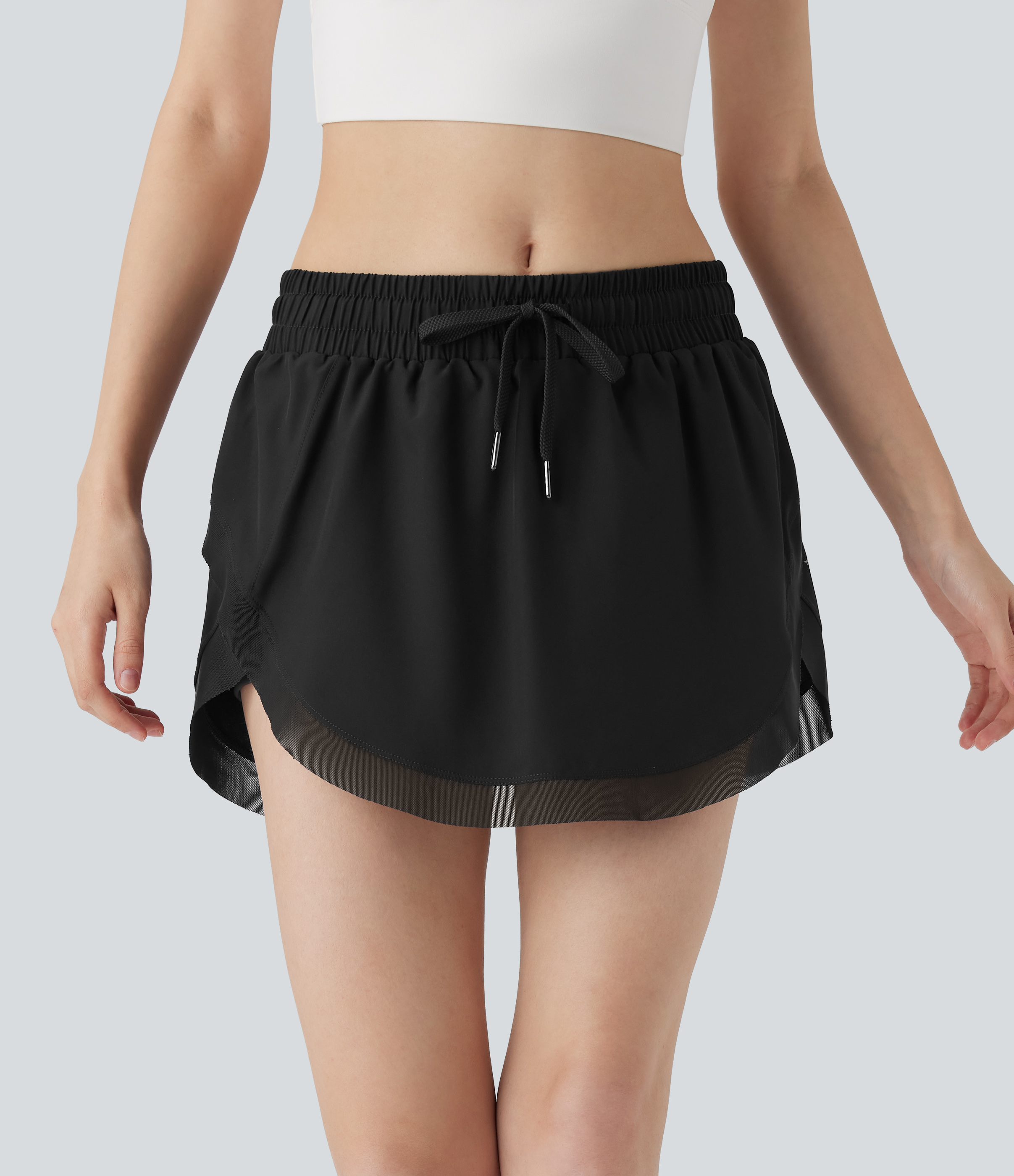 Halara – 2-in-1 Tennis-Minirock mit mittelhohem Bund, Seitentaschen, Kordelzug und kontrastierendem Netzstoff – Schwarz – L