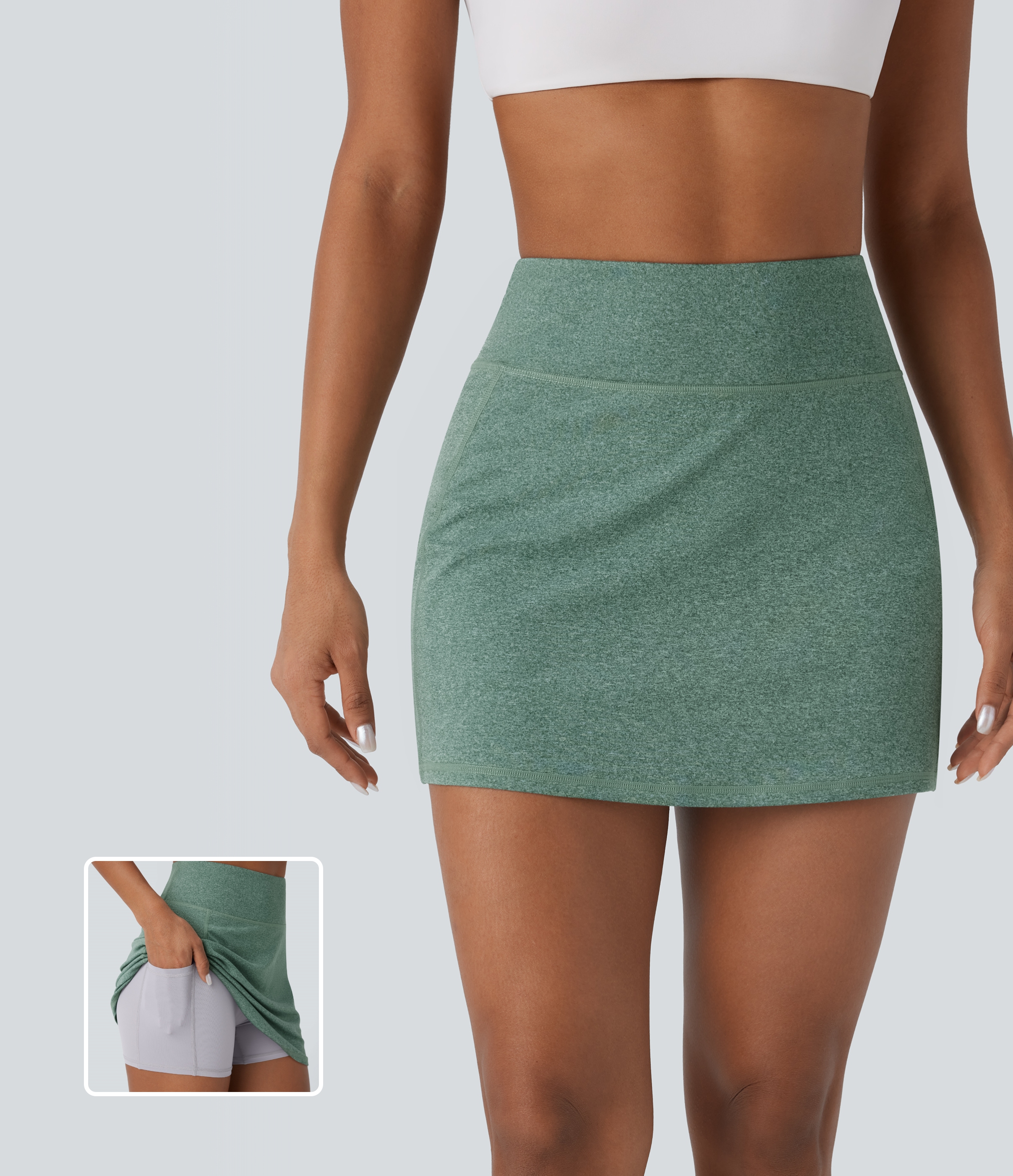 Mottled Pine Green 2-in-1 pickleball mini skirt with a high-rise waistband and side pockets / 1