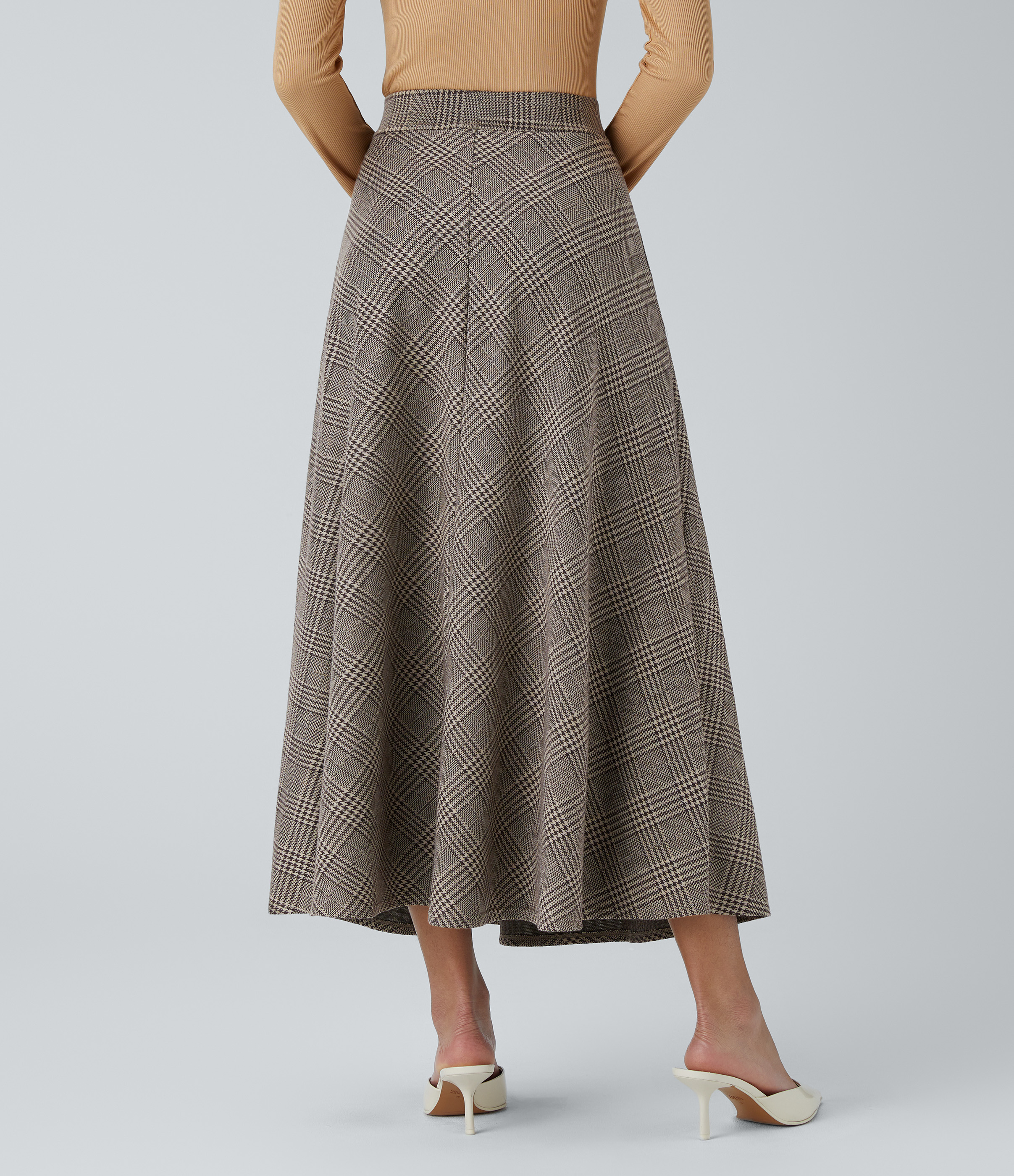Brown Houndstooth Plaid Casual midi skirt with a flared hem, houndstooth pattern, and a side pocket. / 2
