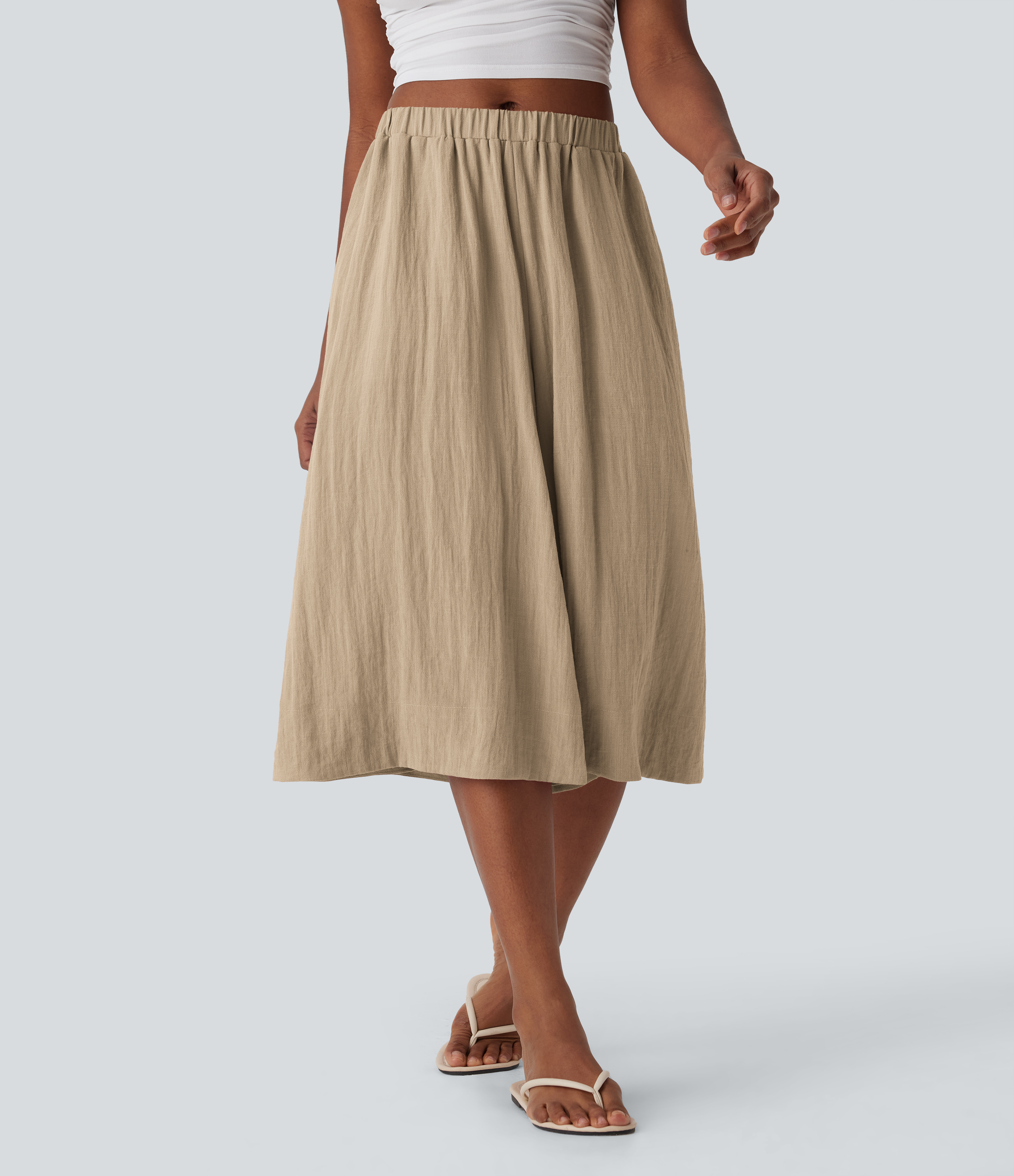 Pantalones de lino anchos y fluidos de tiro medio con bolsillos laterales