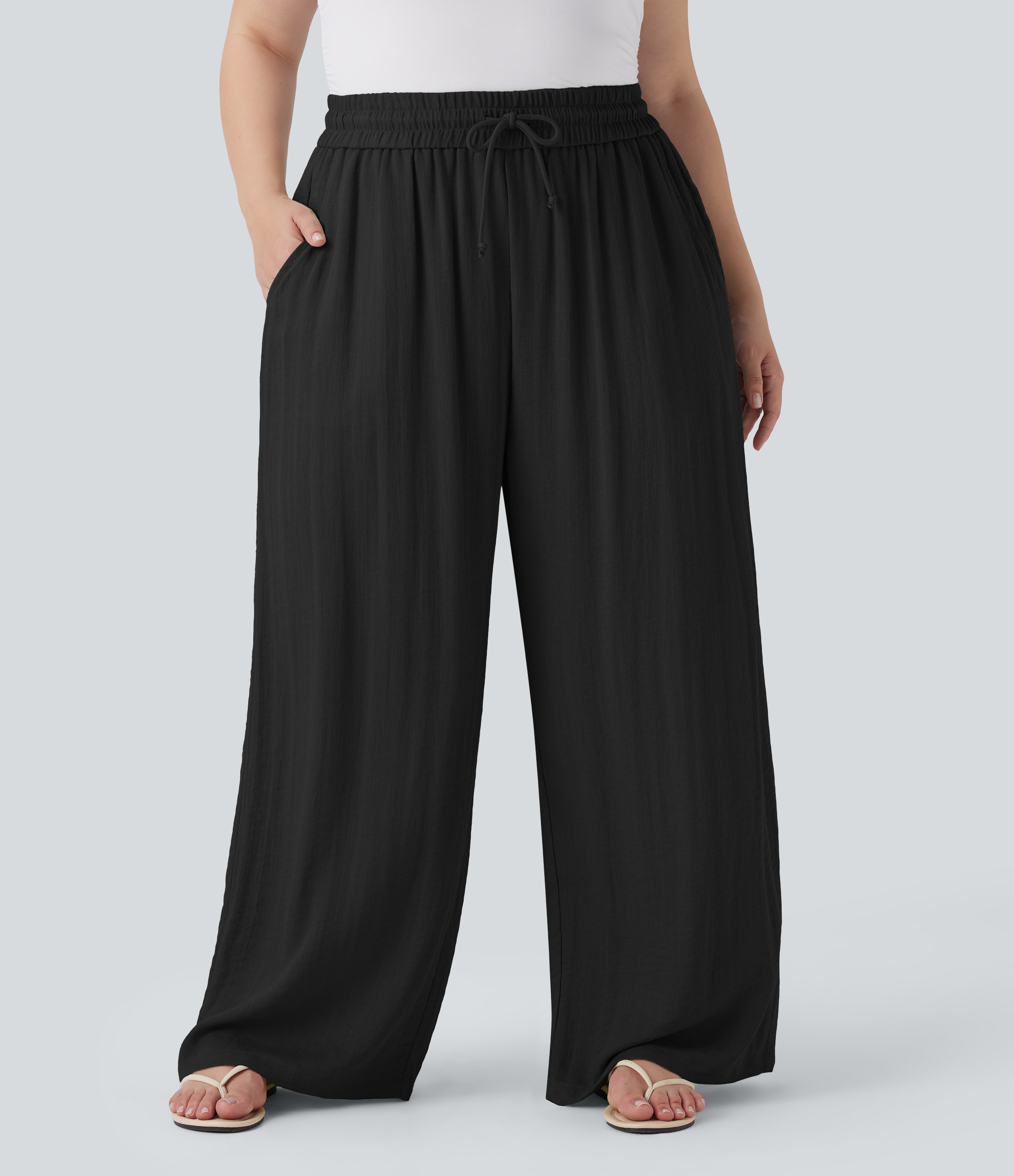 Pantalon décontracté grande taille large fluide taille haute effet lin avec cordon de serrage et poches