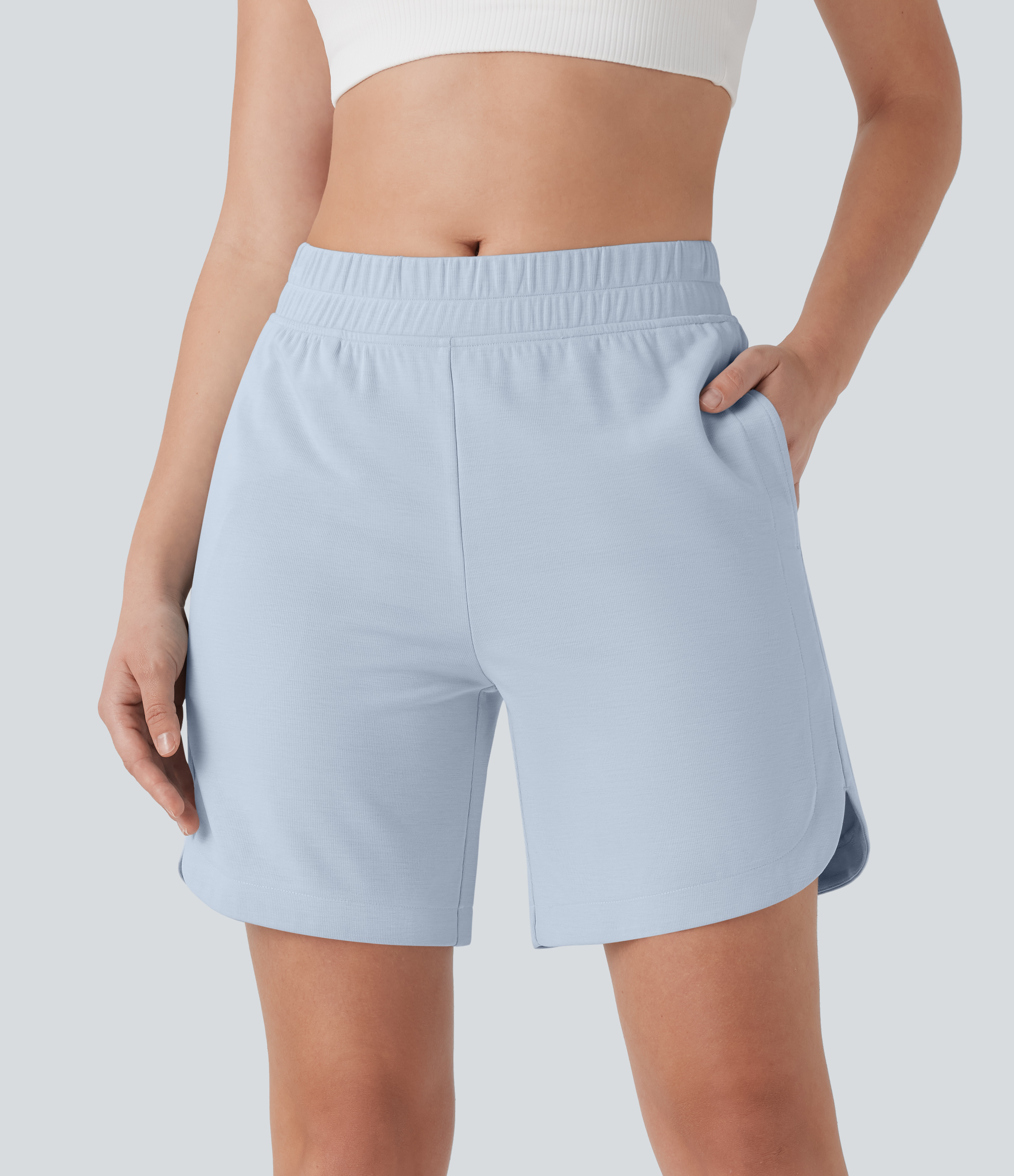 Bermudas de yoga con cintura media, bolsillos laterales y dobladillo curvo