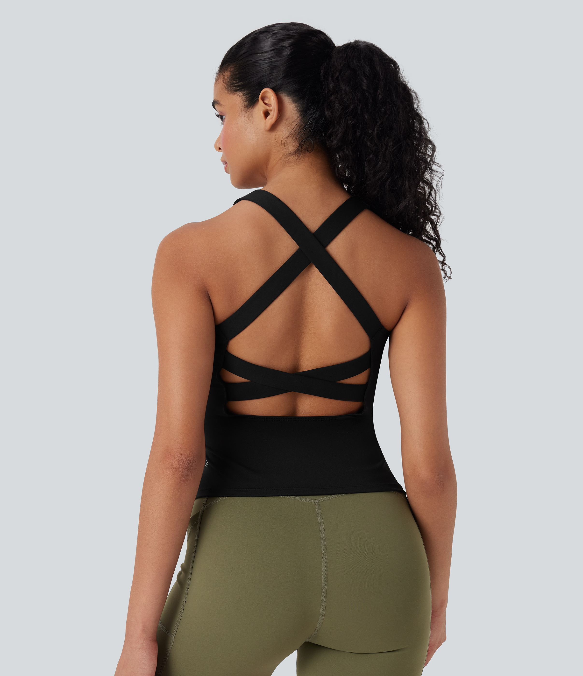 Camiseta de tirantes cruzada para running con espalda abierta