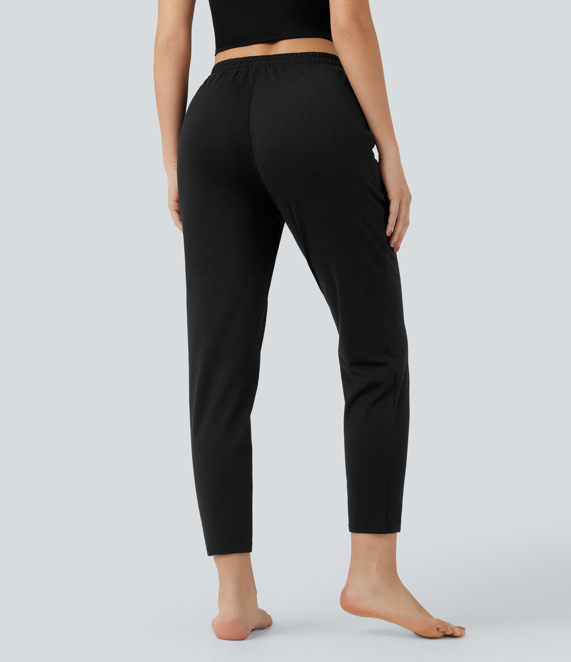 Coal Fade Heathered lounge pants with a mid-rise waistband, side pockets and a drawstring — quick-drying, warming and UPF 40+ sun protection. / 2