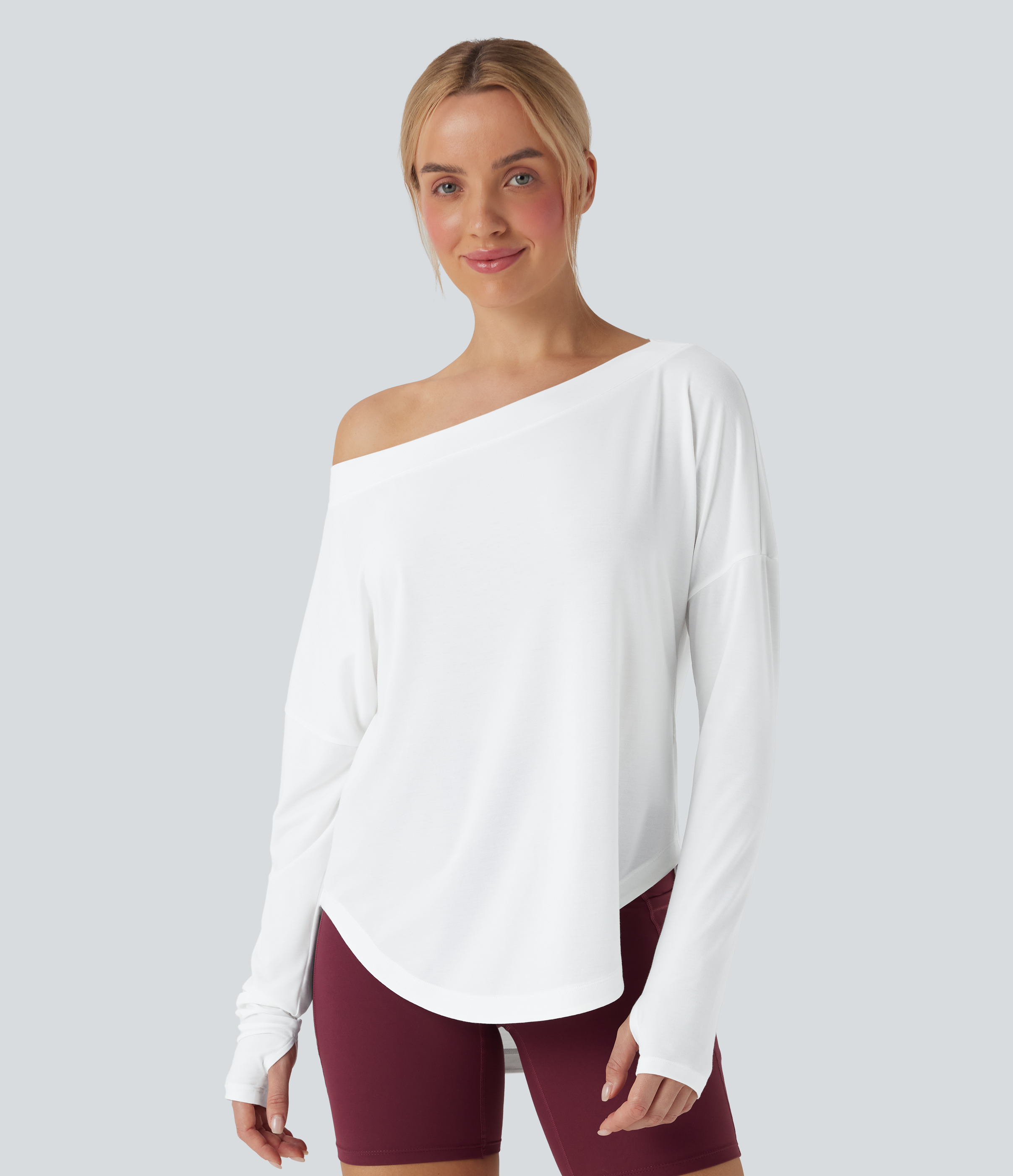 Top deportivo de yoga de secado rápido, de manga larga, con un solo hombro, abertura para el pulgar, dobladillo curvo y abertura para el pulgar.