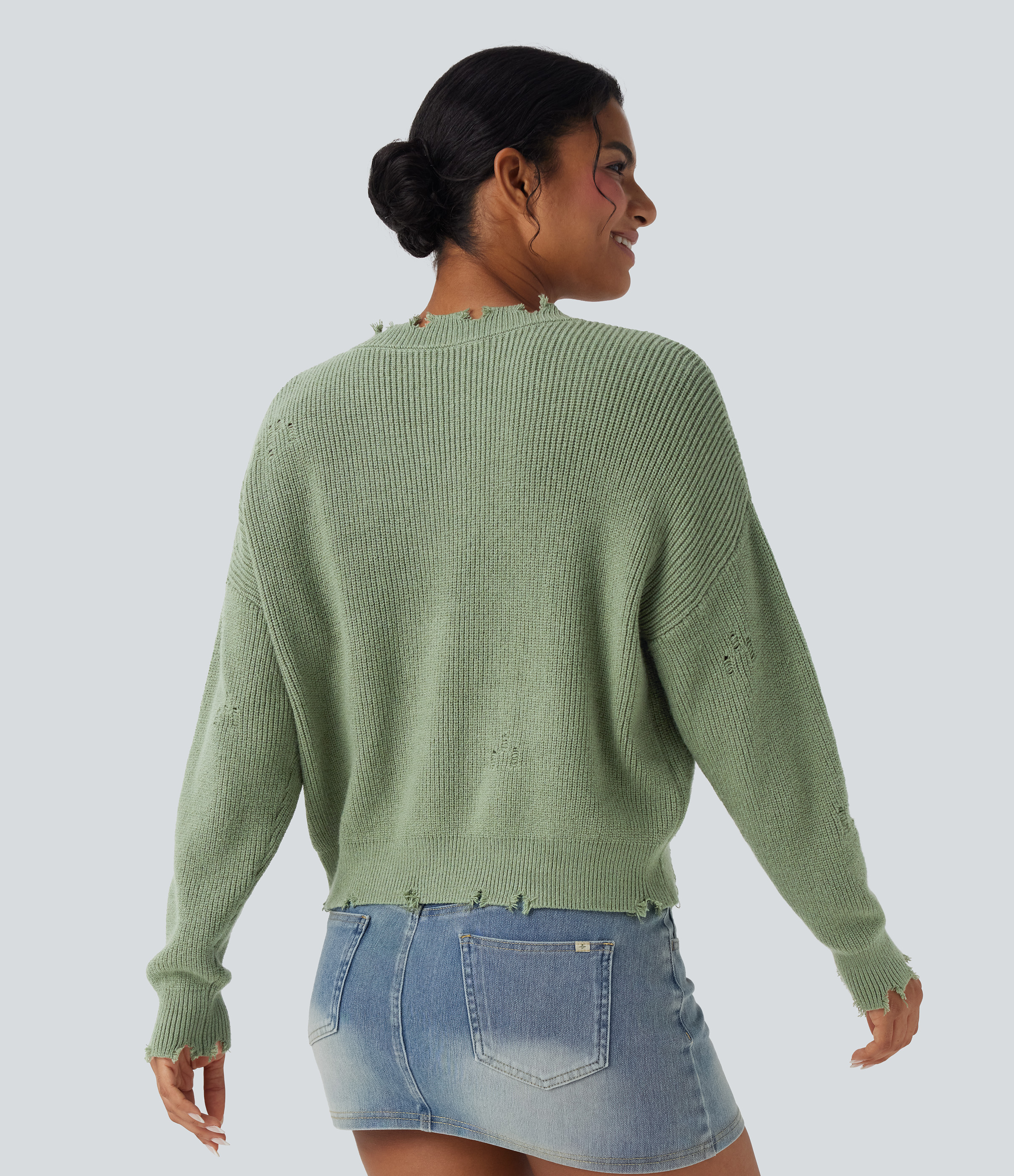 Green Pine Casual V-neck sweater with a worn-in look. / 2