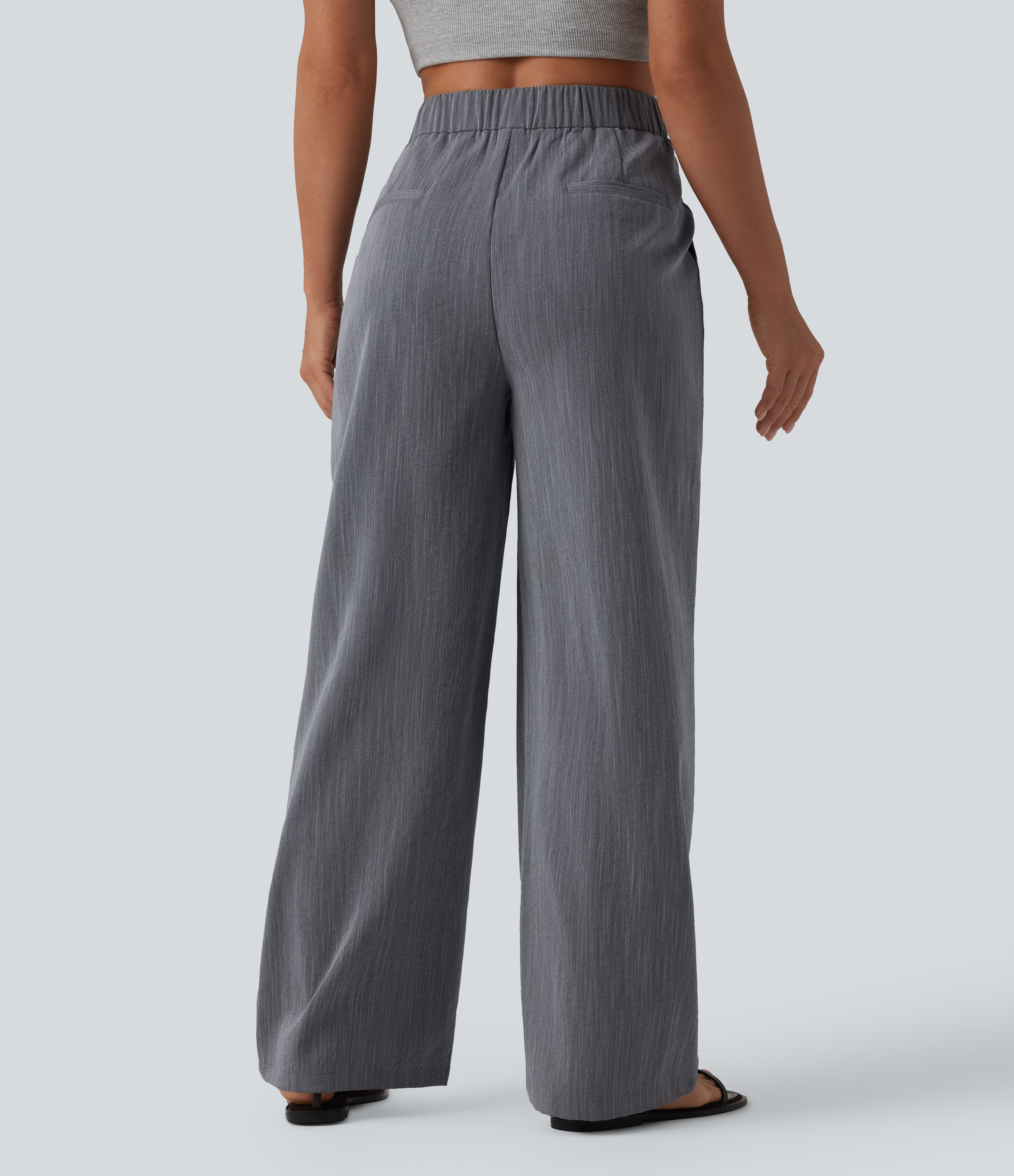 Obsidian Weave Pantalones holgados asimétricos de talle medio, con pliegues, tacto lino y bolsillos. / 2