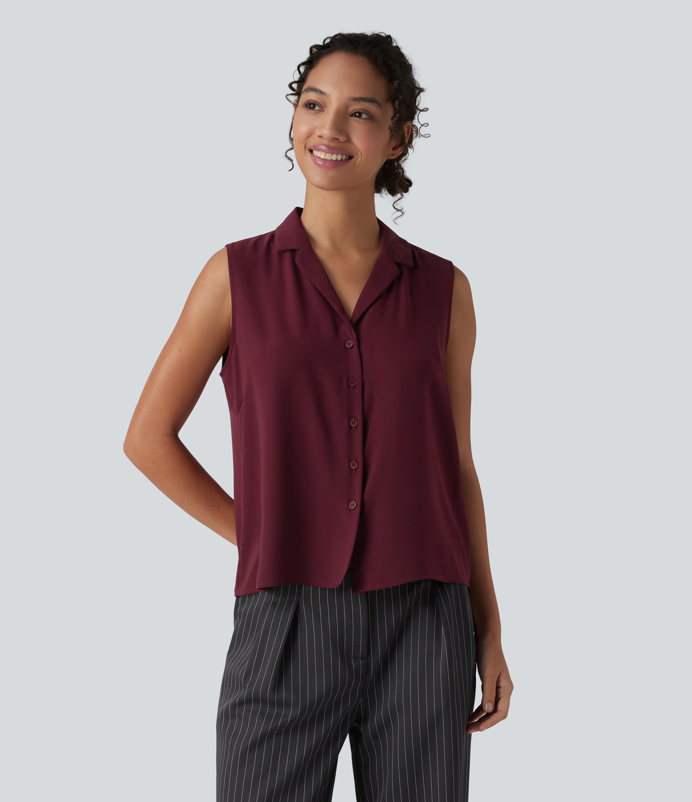 Blouse tailleur ample col revers sans manches à boutonnière