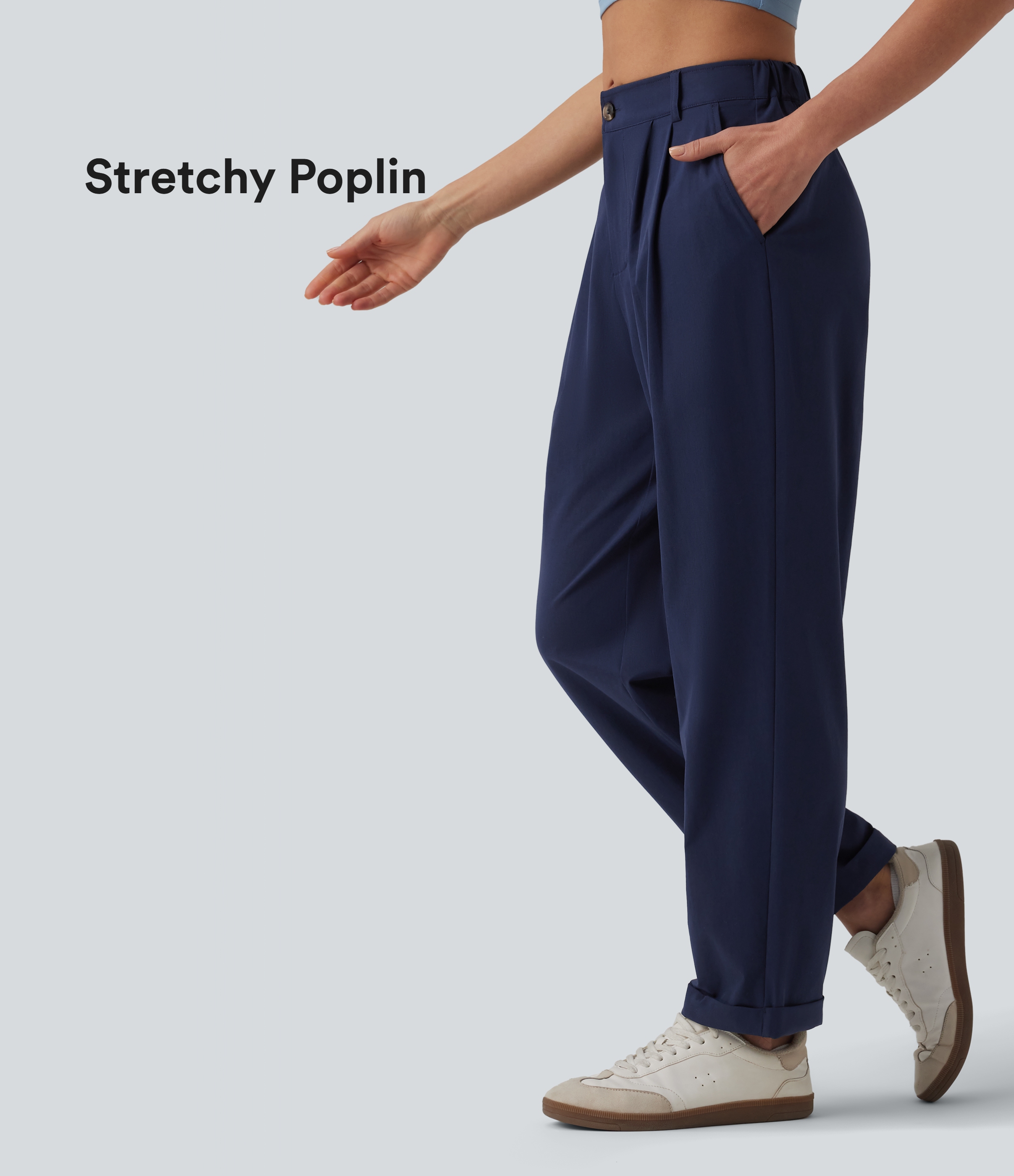 Pantalón casual, cónico, de 7/8 con cintura media, múltiples bolsillos y dobladillo vuelto.