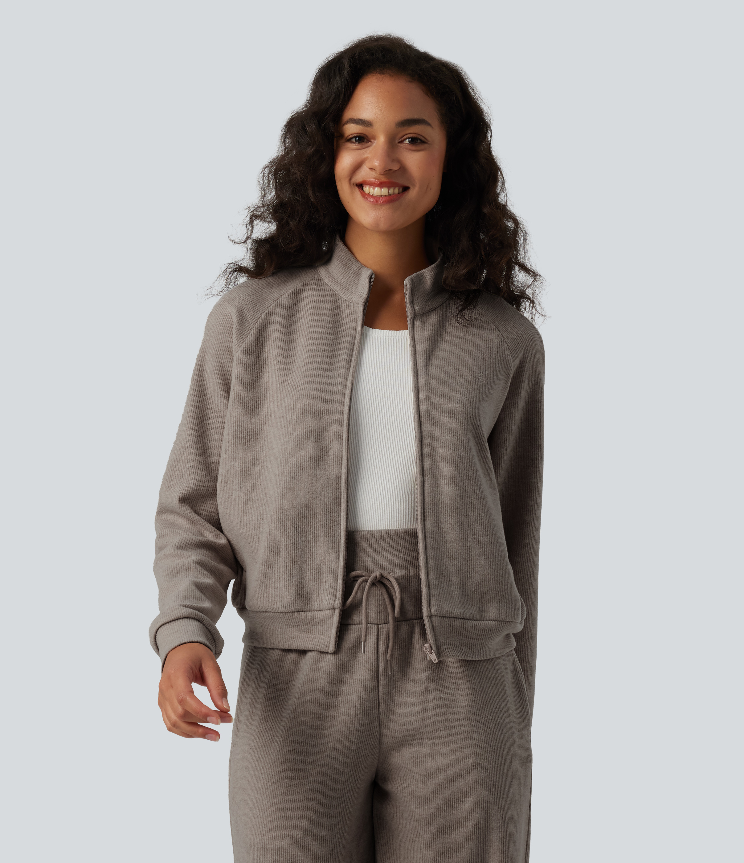 Veste casual côtelée à col montant, manches longues et fermeture zippée avec poches