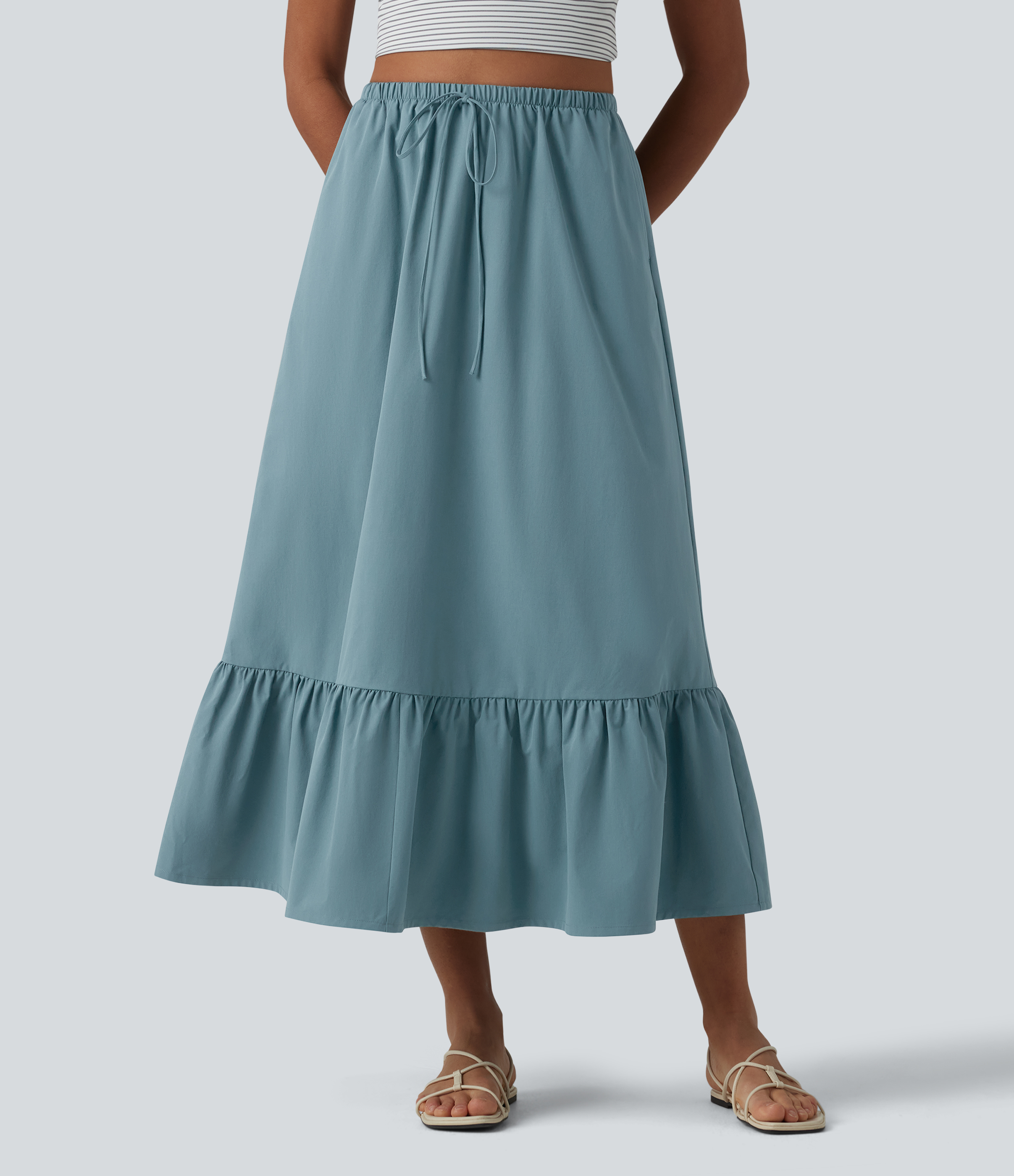 Jupe casual mi-longue évasée en popeline stretch taille haute avec cordon de serrage, ourlet volanté et poches