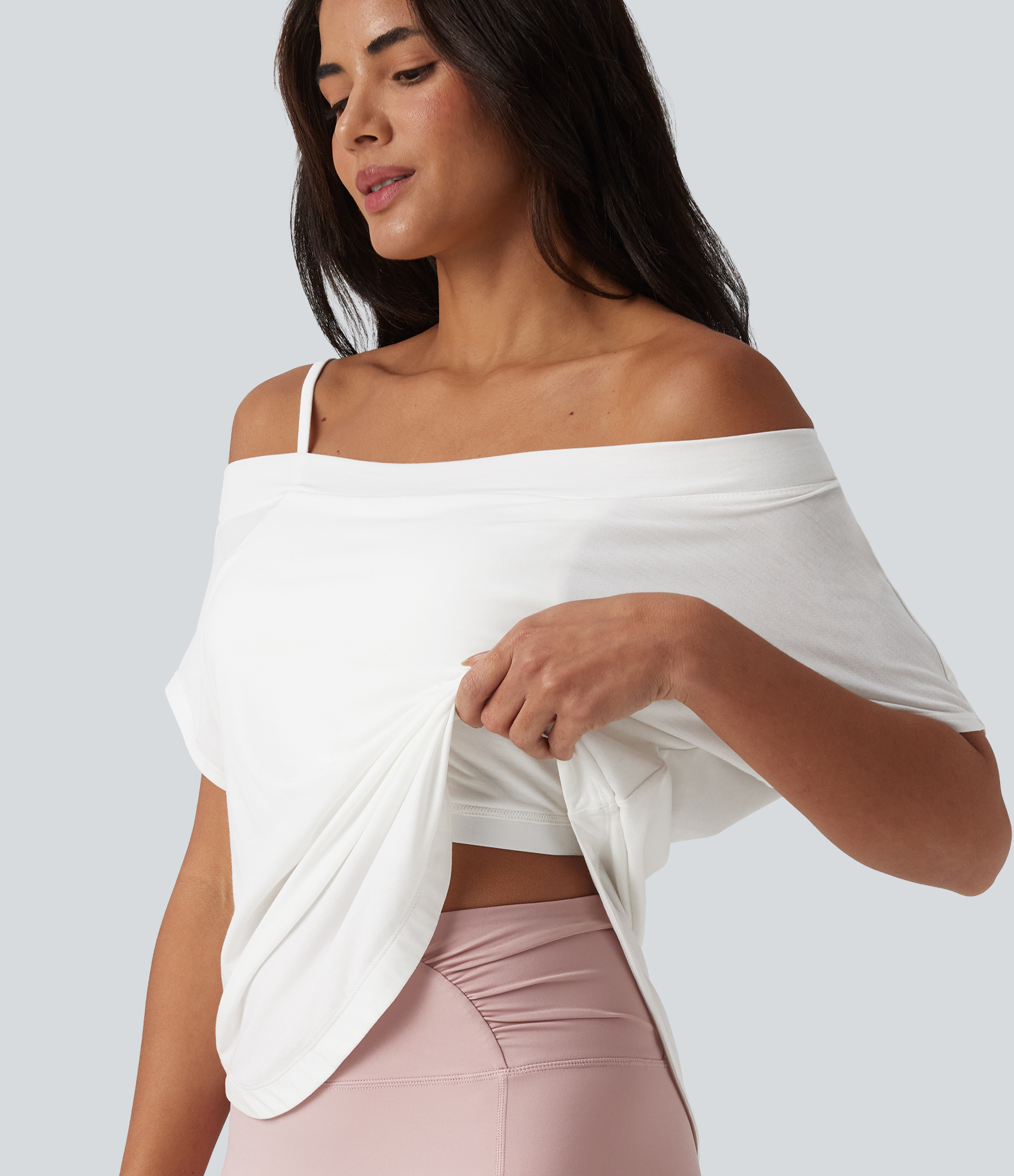 One-shoulder yoga top with short sleeves, an asymmetrical hem, and a built-in quick-drying bra