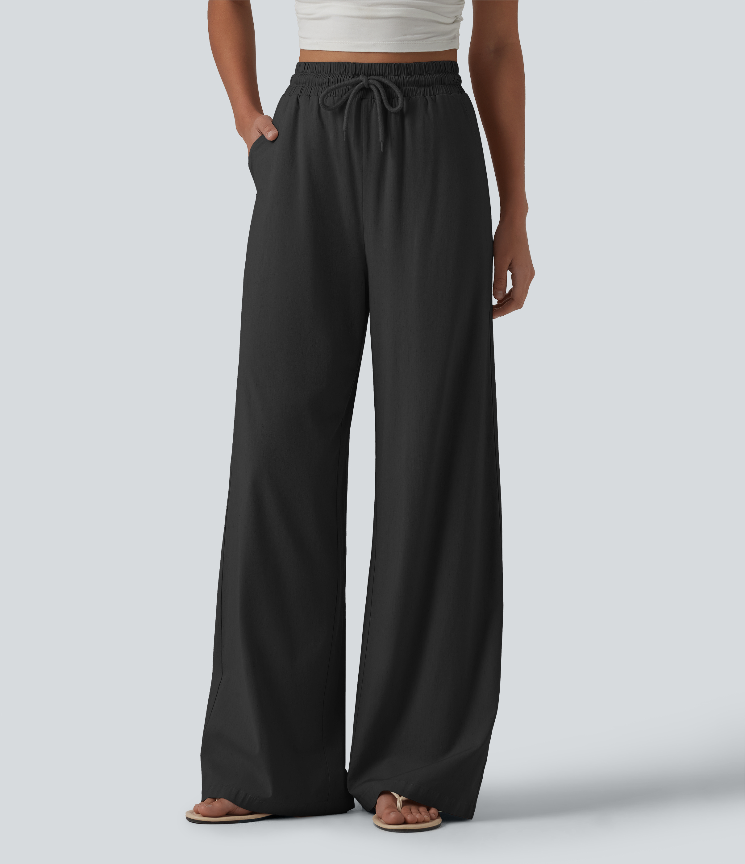 Black Pantalon large fluide en lin stretch taille haute avec cordon de serrage et poches / 1