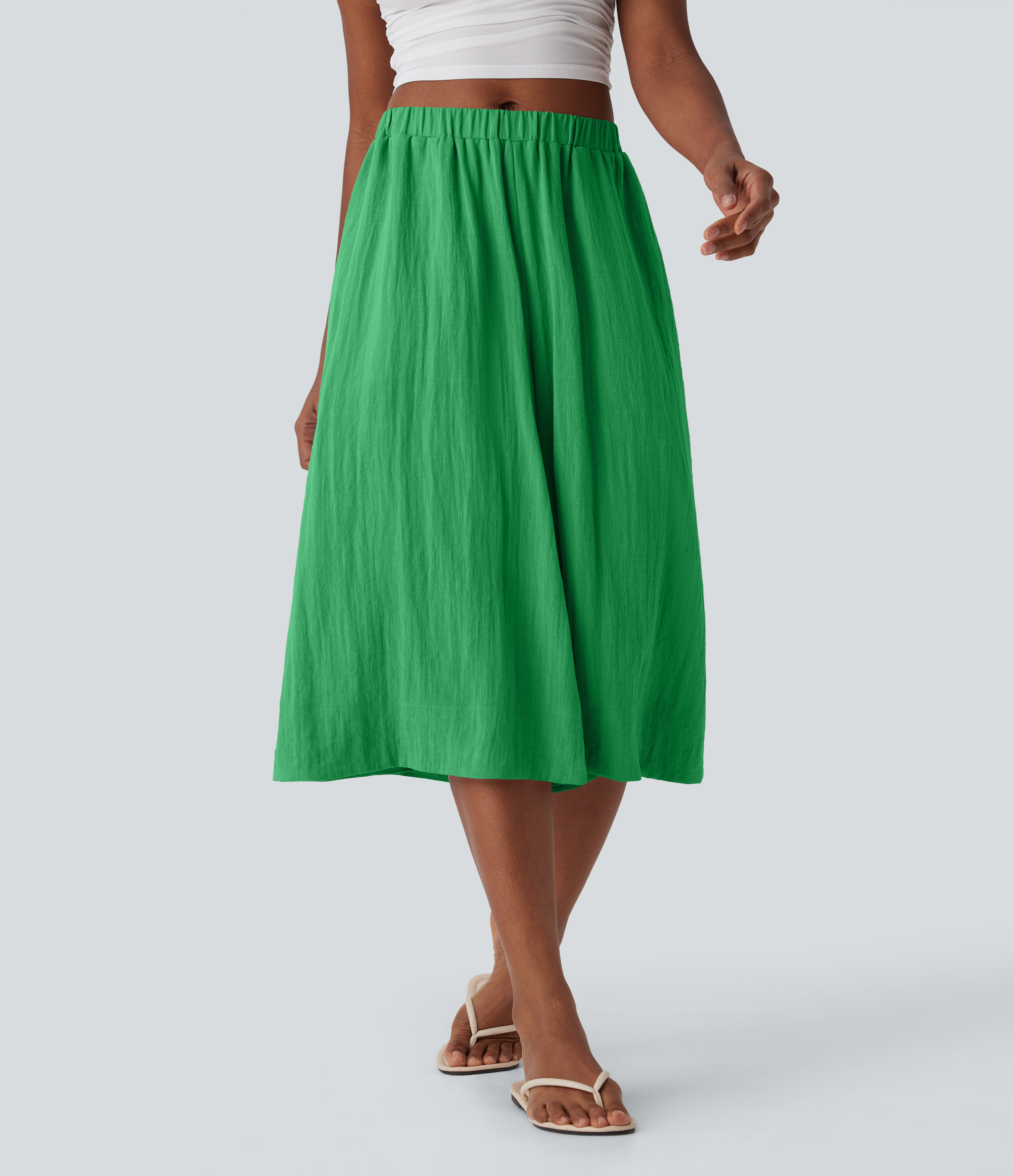 Pantalones de lino anchos y fluidos de tiro medio con bolsillos laterales