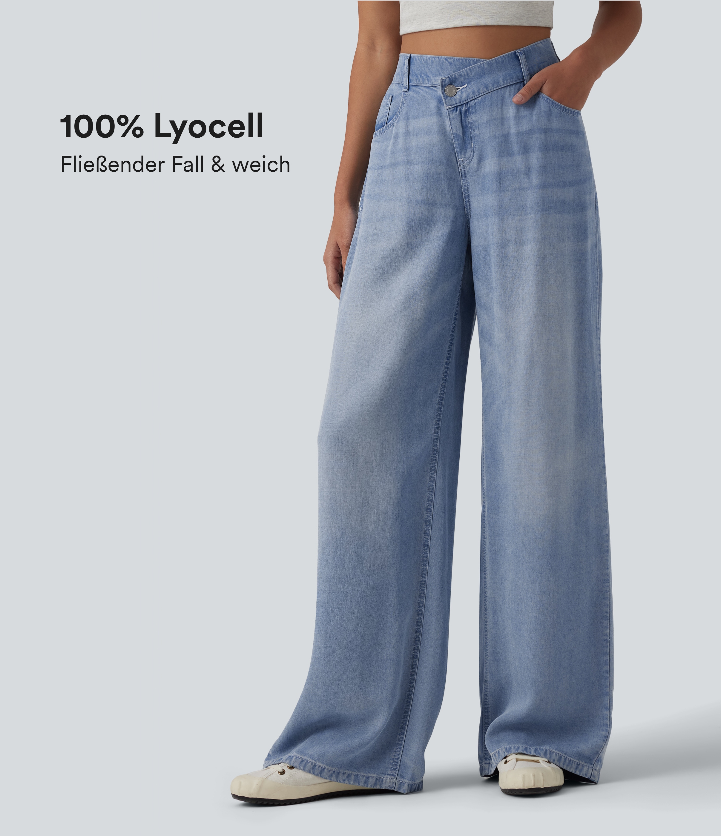 Lässige Jeans aus Lyocell mit mittelhohem Crossover-Bund, mehreren Taschen und weitem Bein