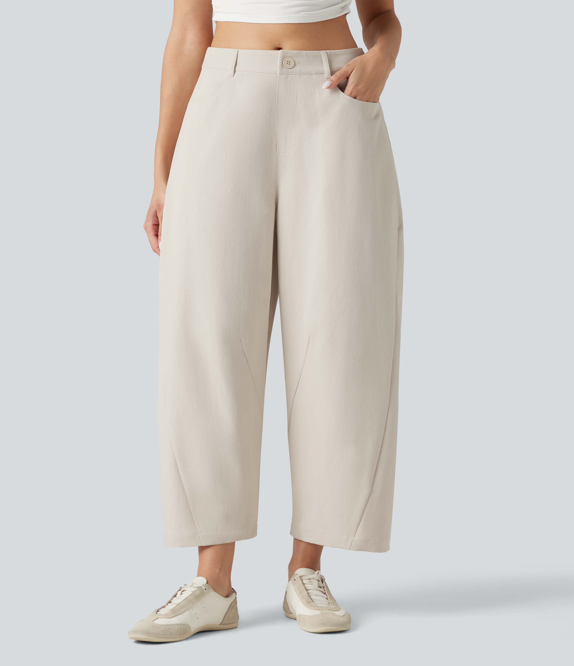 Pantalon décontracté à taille mi-haute, coupe ample et jambes fuselées, avec poches