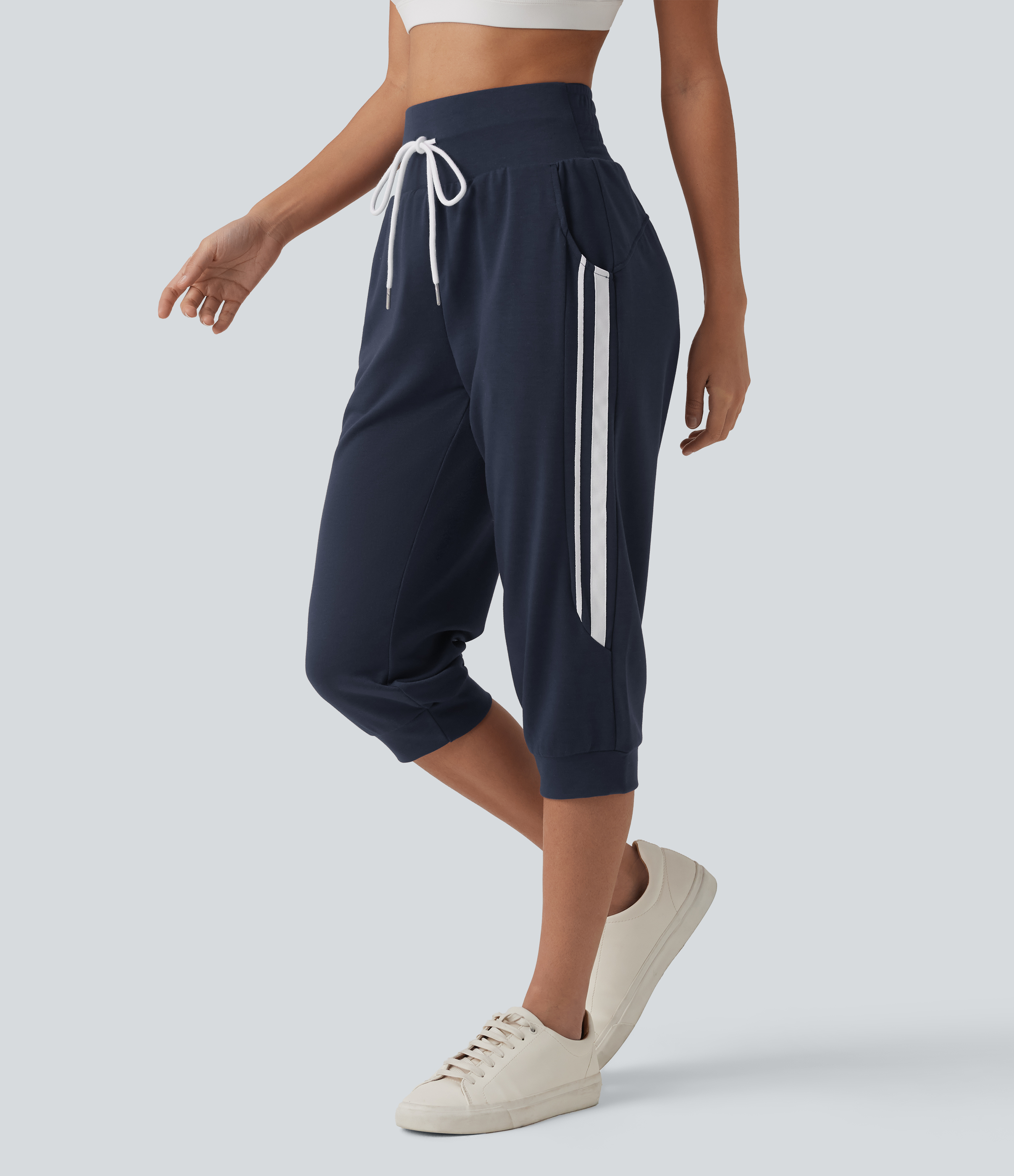 Pantalones jogger capri casual de cintura alta con cordón, a rayas y con bolsillos.