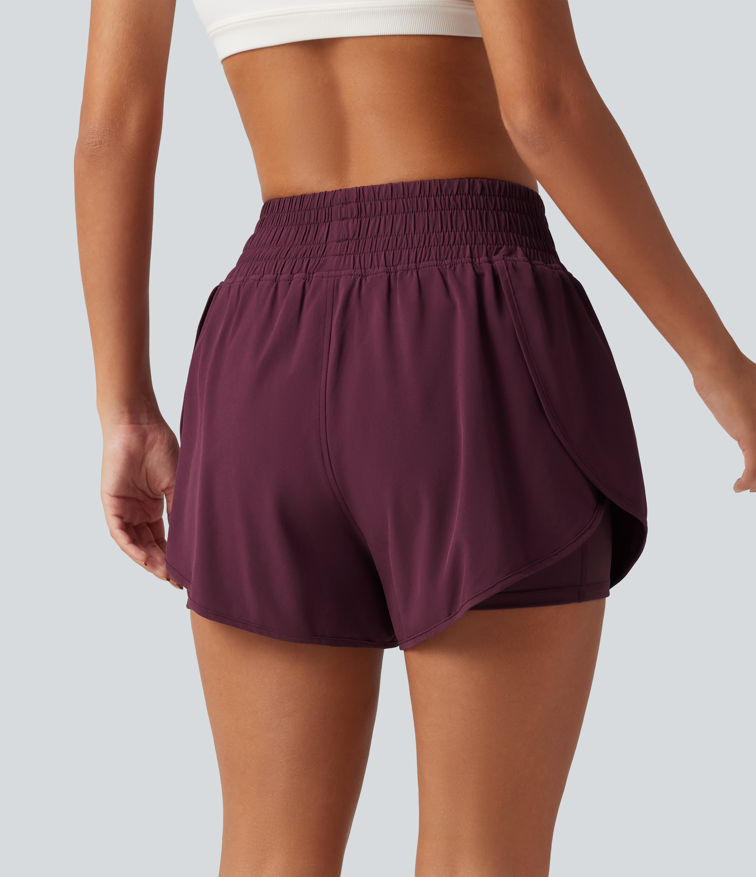 Amaranth Breezeful™ shorts de running de talle alto 2 en 1 con cruce, dobladillo curvado, secado rápido, 3'' con bolsillos / 2