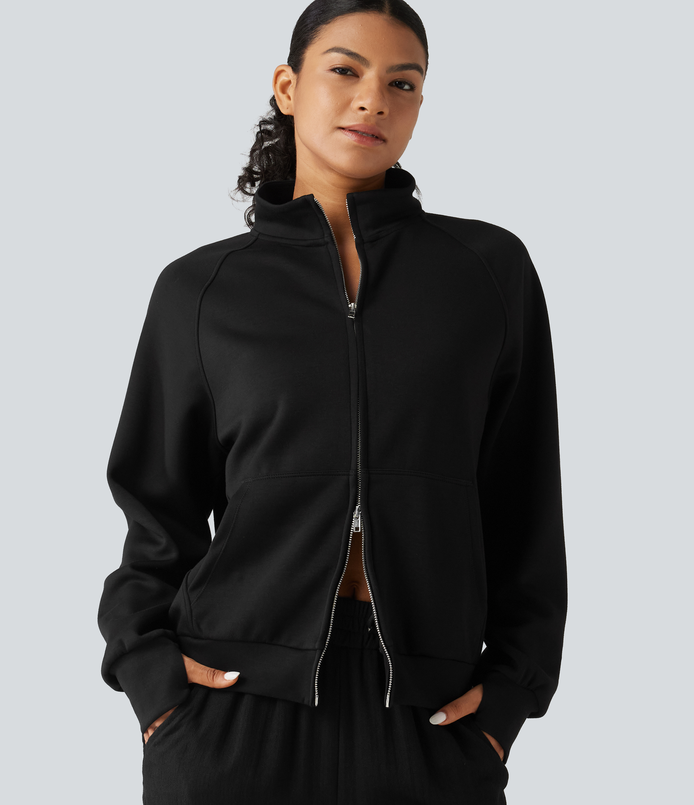 Veste à col montant, zip double sens, manches longues avec passe-pouces et poches