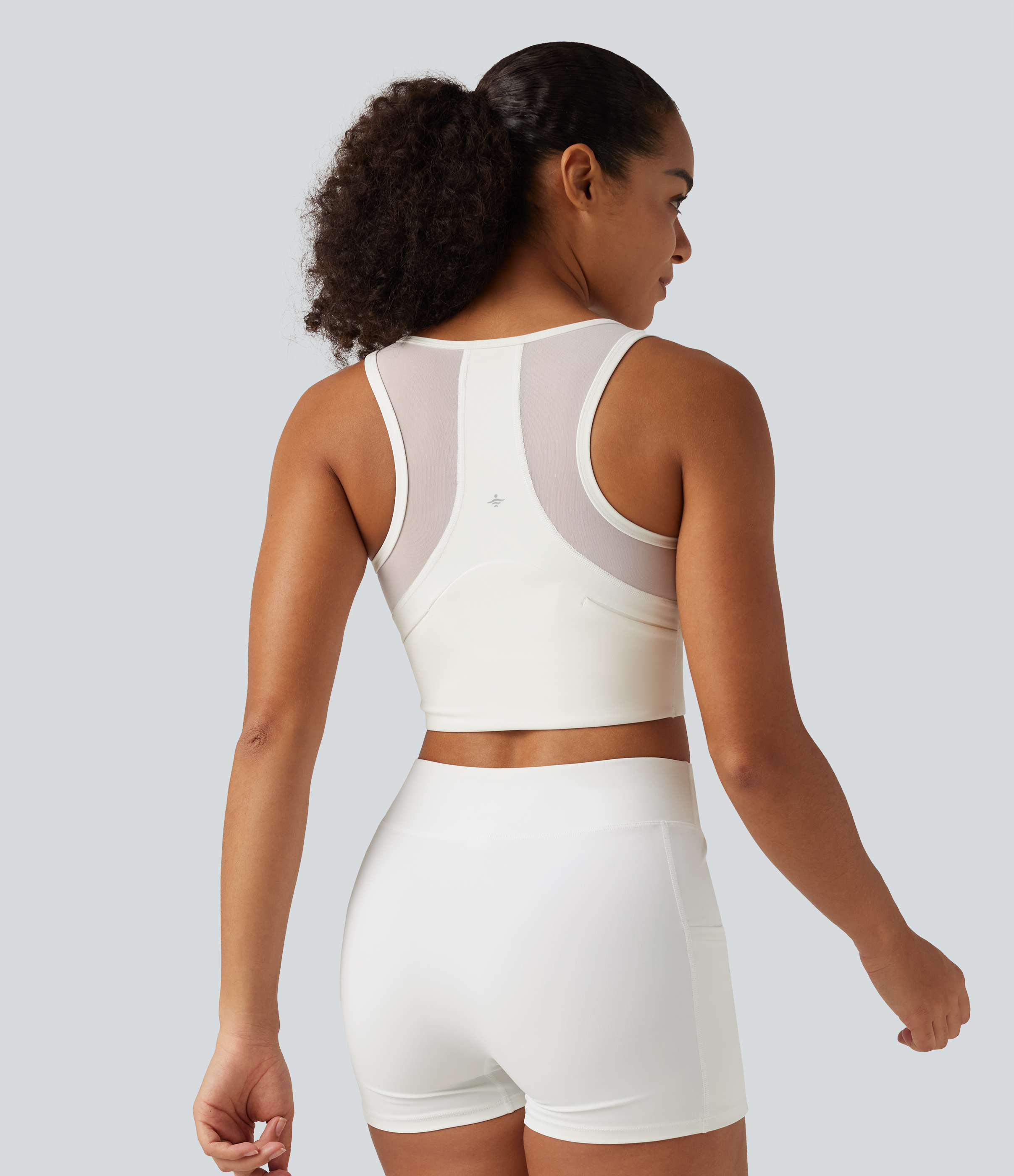 Cropped yoga tank top with U-neckline, back pockets, zipper, built-in bra and contrast mesh