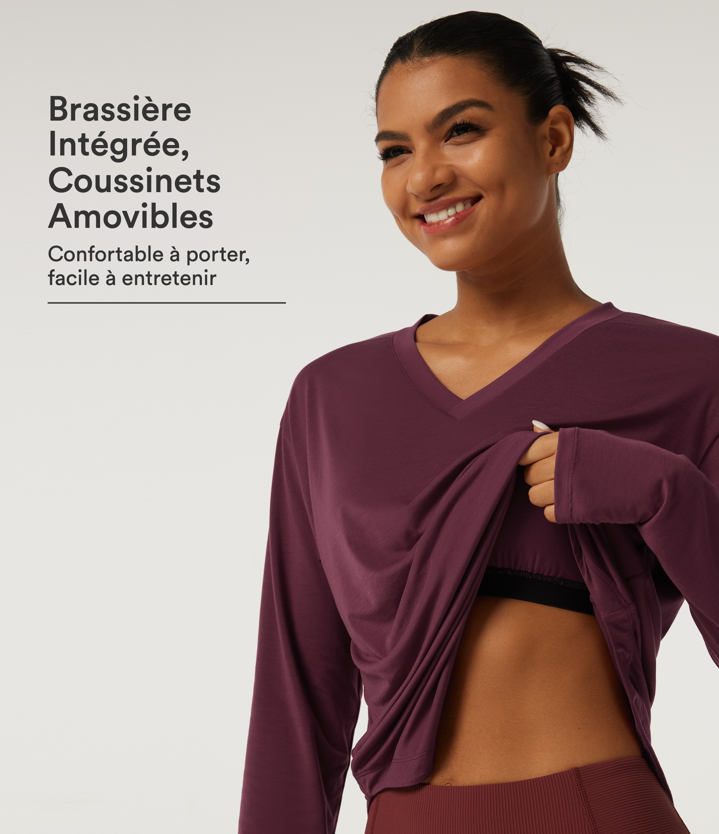 Top de yoga séchage rapide à col V et manches longues, avec brassière intégrée, ourlet arrondi et passe-pouces