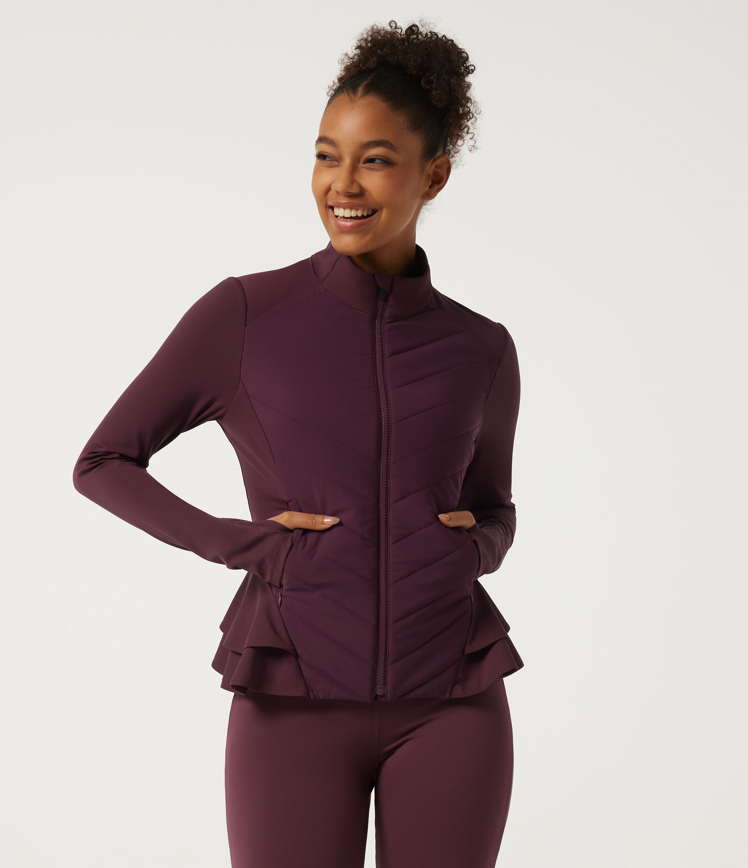 PuffFlex High Neck Long Sleeve Quilted Curved Hem Casual Padded Jacket with Pockets and Thumbholes